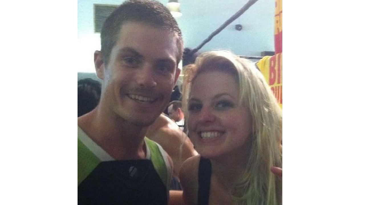 Grayson Waller posing with Candice LeRae in a throwback picture