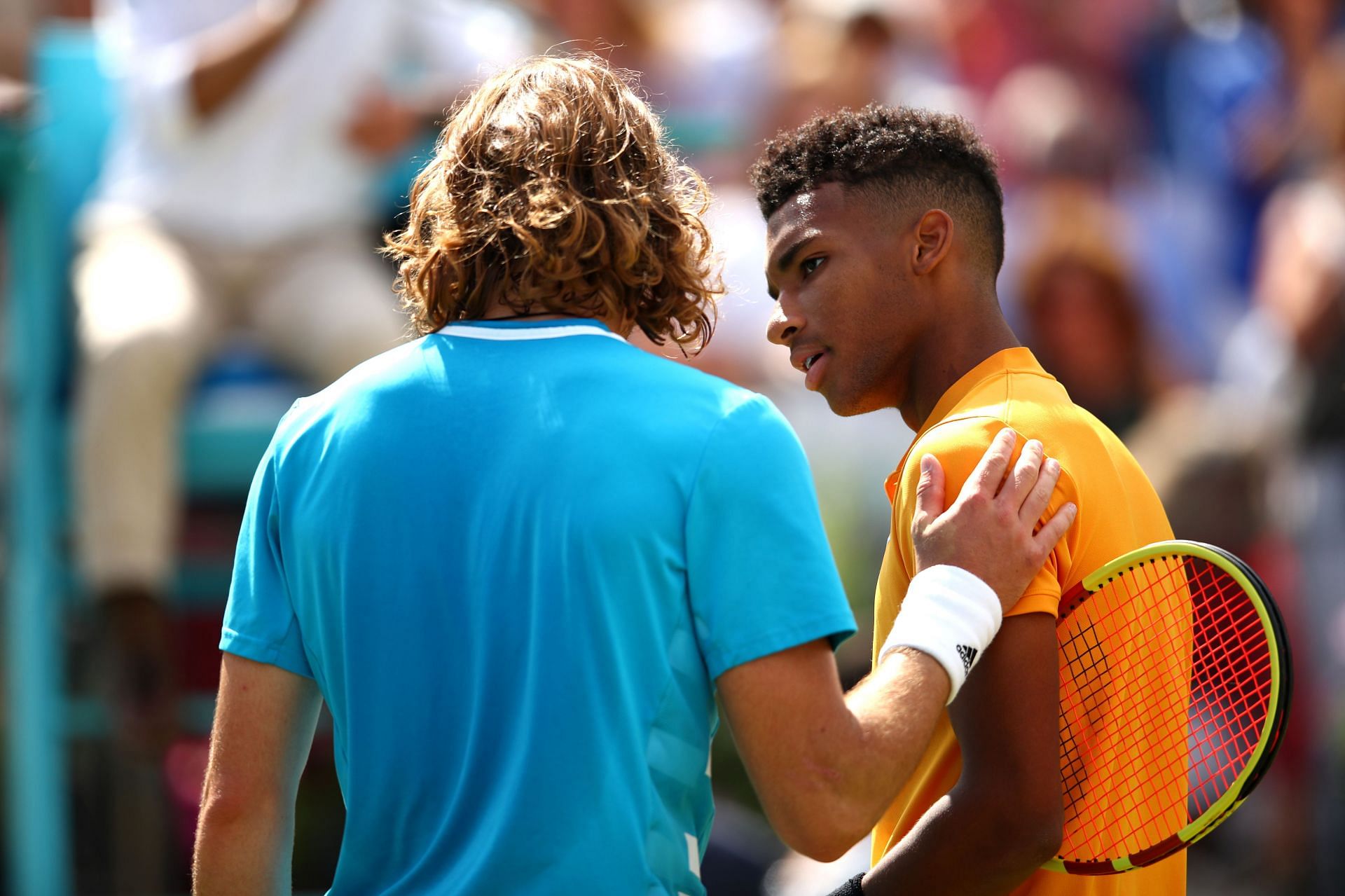 Stefanos Tsitsipas (L) and Felix Auger-Aliassime at the Fever-Tree Championships - Day Five.