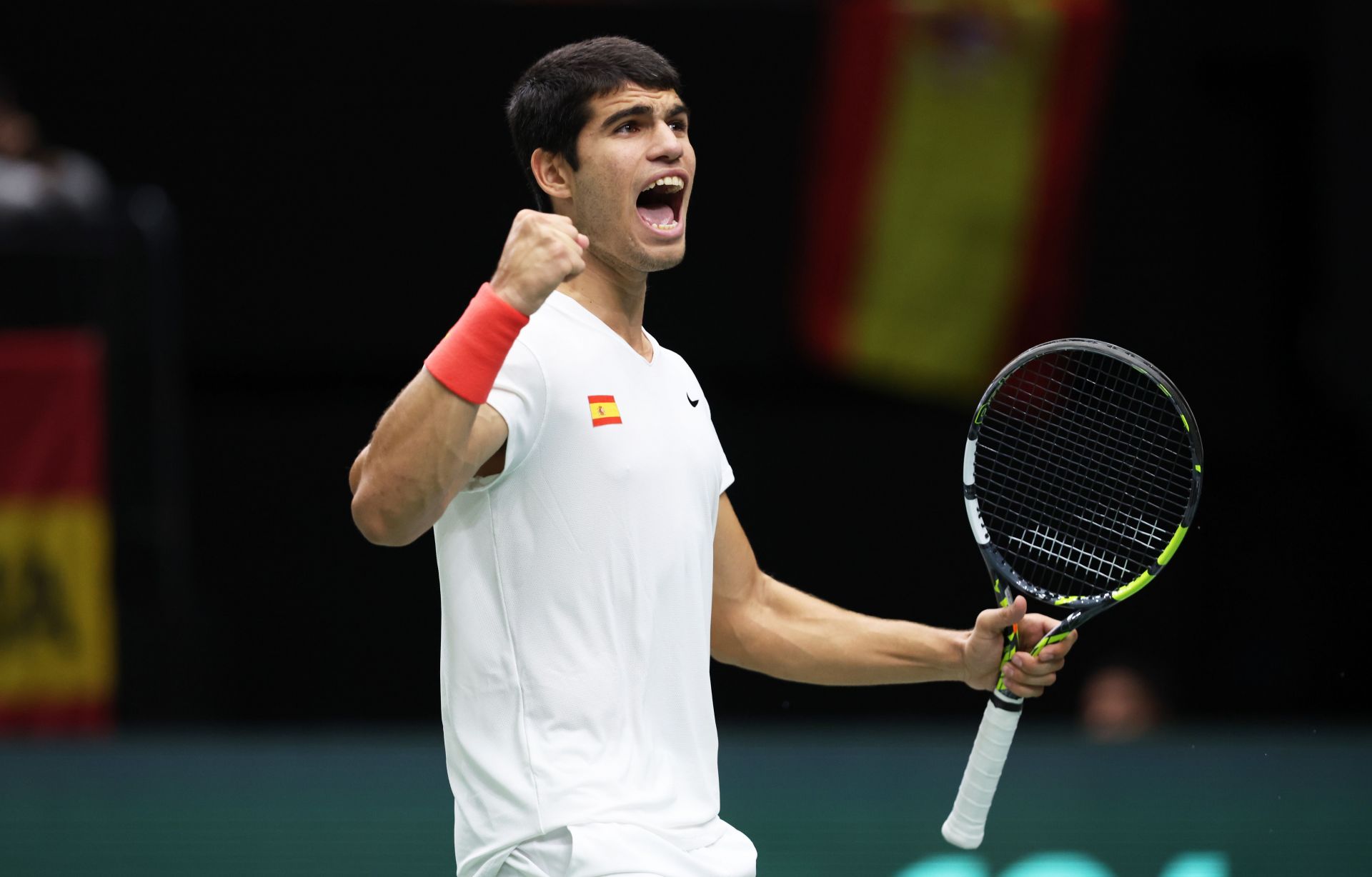 Carlos Alcaraz of Team Spain celebrates winning set point against Felix Auger Aliassime at the Davis Cup