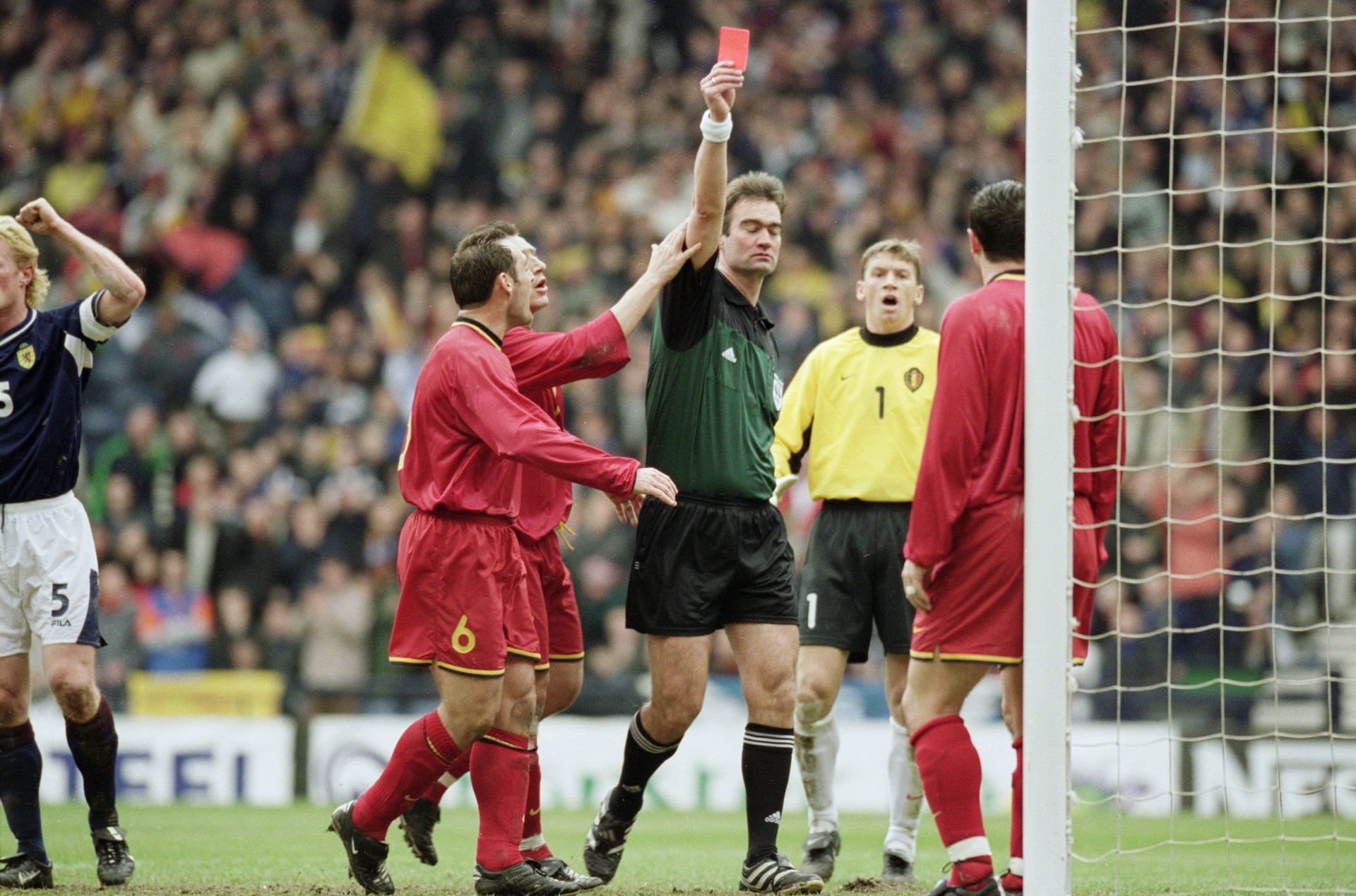 Referee Kim Milton Nielsen of Denmark sends off Eric Deflandre of Belgium during the World Cup 2002 Group Six Qualifying match against Scotland played at Hampden Park, in Glasgow, Scotland.