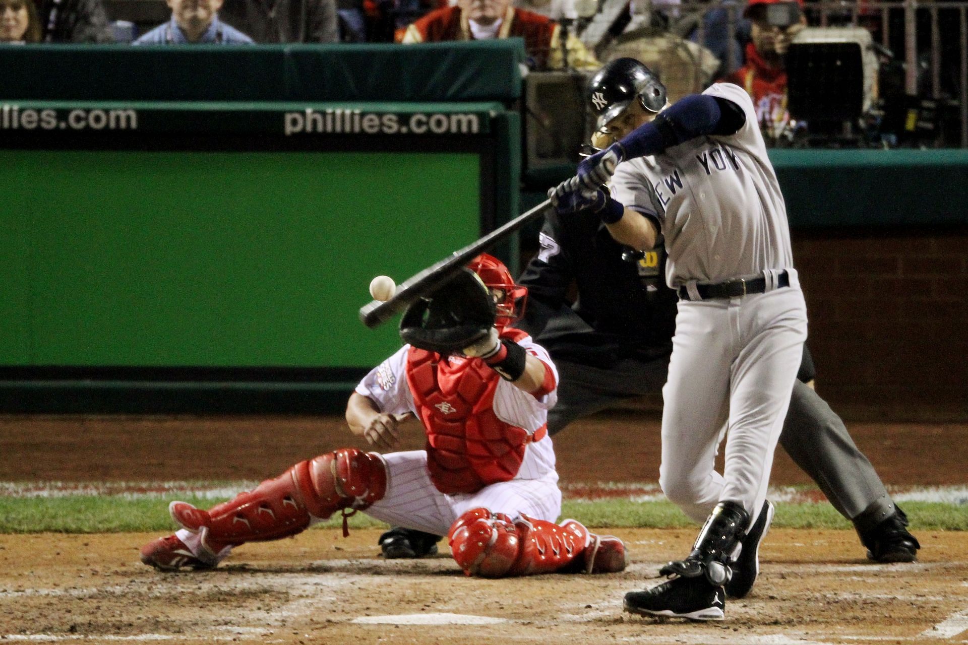 Derek Jeter #2 of the New York Yankees hits a RBI single in the top of the fifth inning against the Philadelphia Phillies in Game Four of the 2009 MLB World Series at Citizens Bank Park on November 1, 2009 in Philadelphia, Pennsylvania.