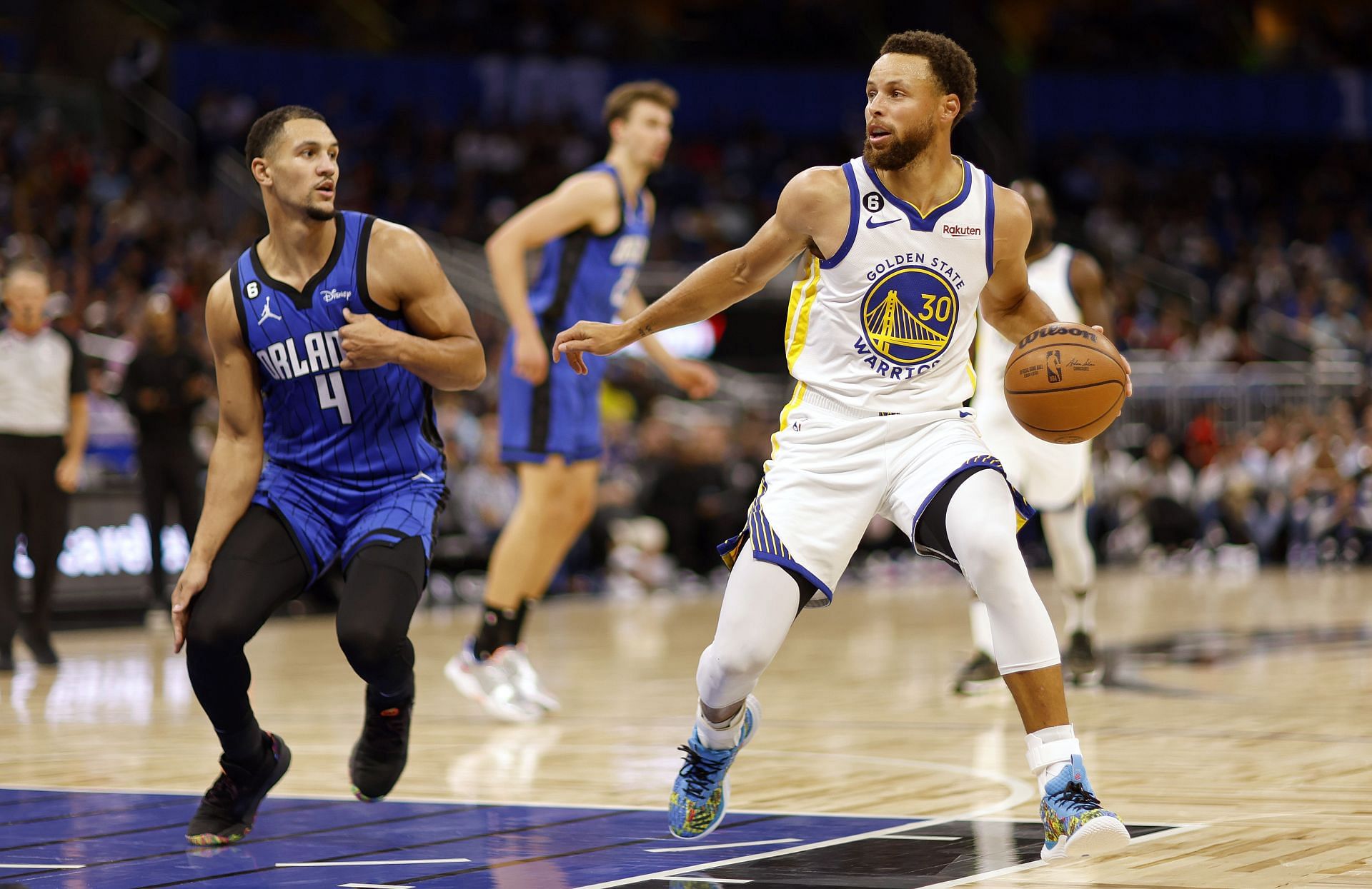 Steph Curry taking his defender off the dribble during the Golden State Warriors' game against the Orlando Magic