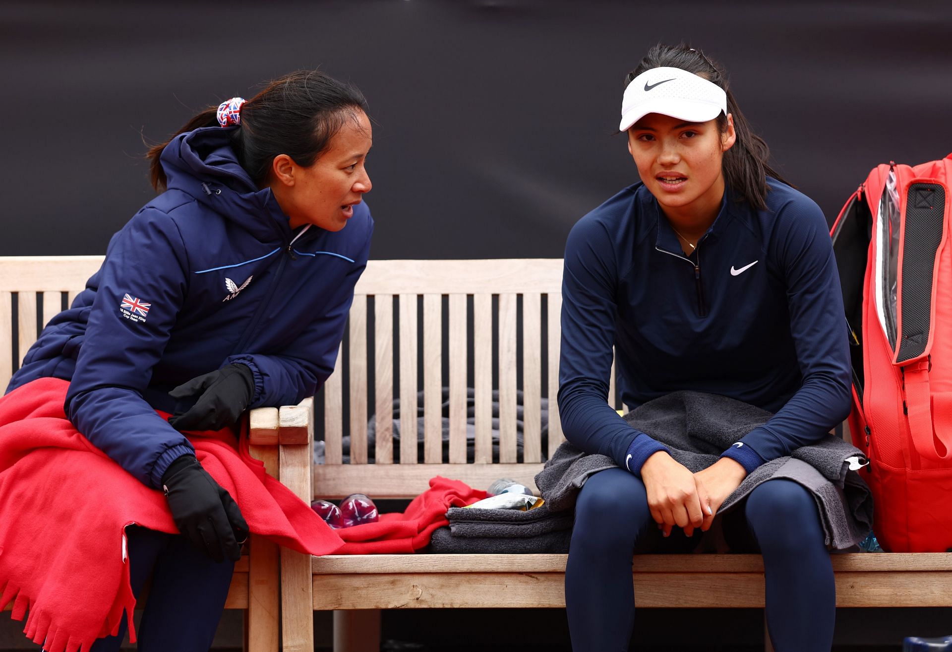 Anne Keothavong and Emma Raducanu in a conversation during the Billie Jean King Cup playoff match between Great Britain and the Czech Republic.