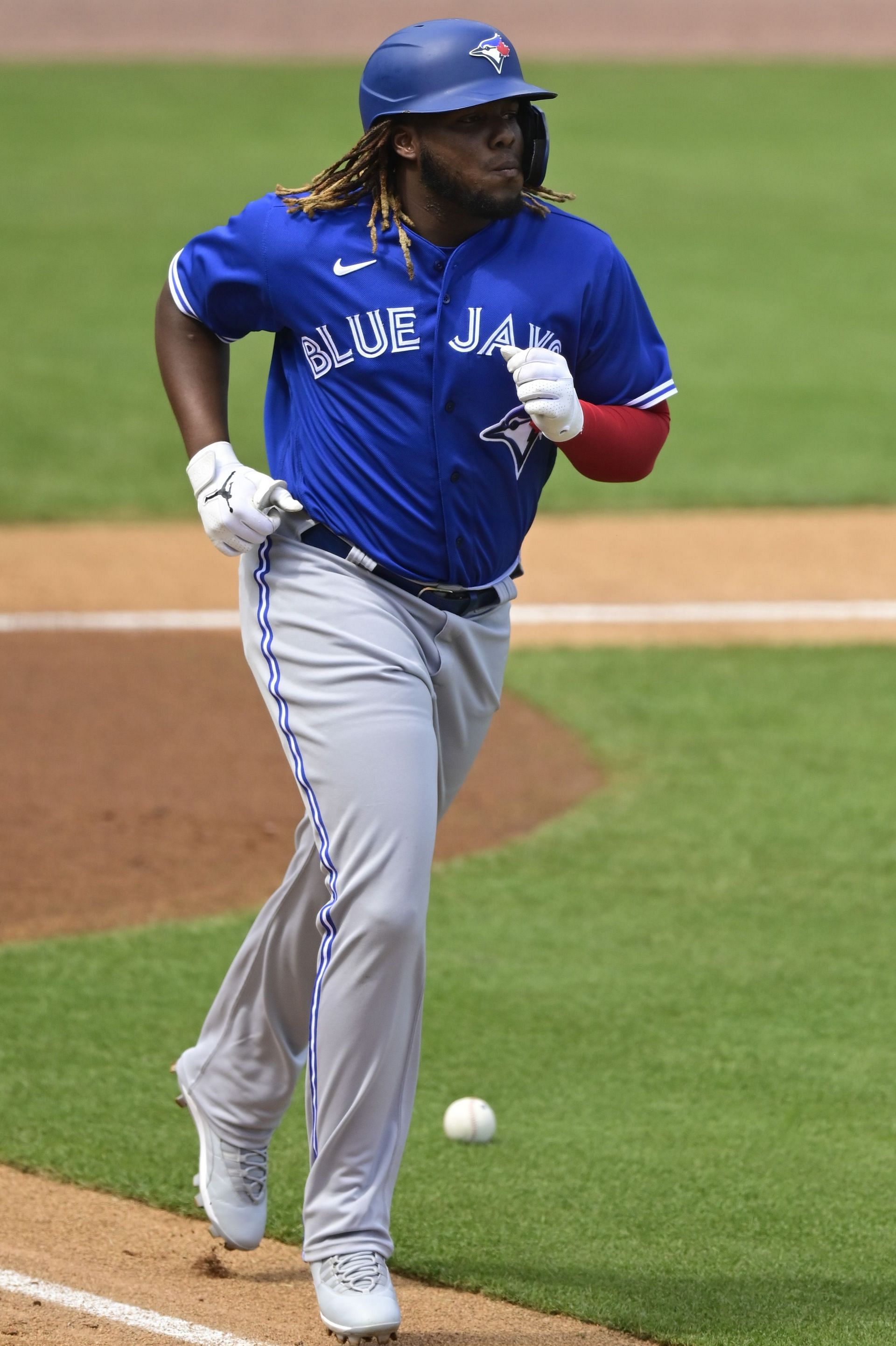 Vladimir Guerrero Jr. #27 of the Toronto Blue Jays walks to first base after being hit by a pitch during the first inning against the New York Yankees during a spring training game at George M. Steinbrenner Field on February 28, 2021 in Tampa, Florida.