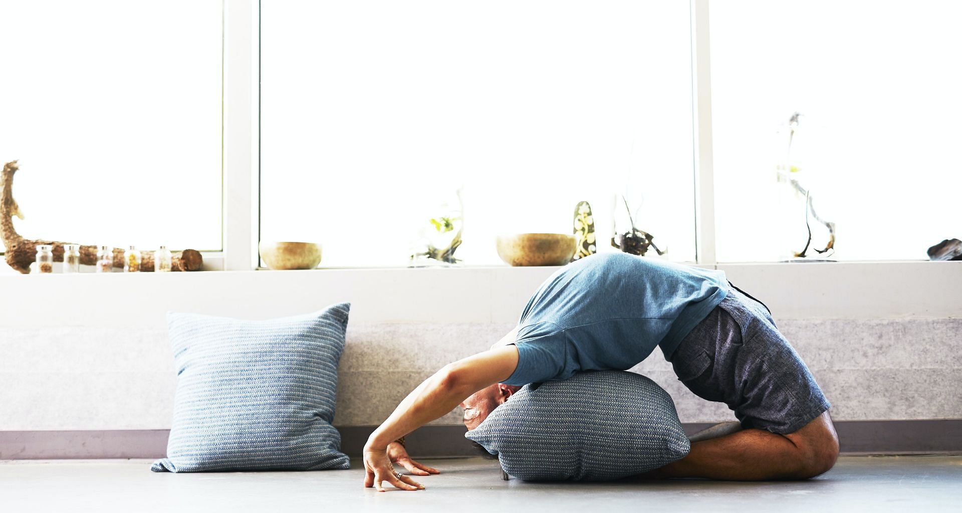 Starting an at-home yoga practice can ultimately help you save time, effort, and money. (Image via Unsplash/ Wee Lee)