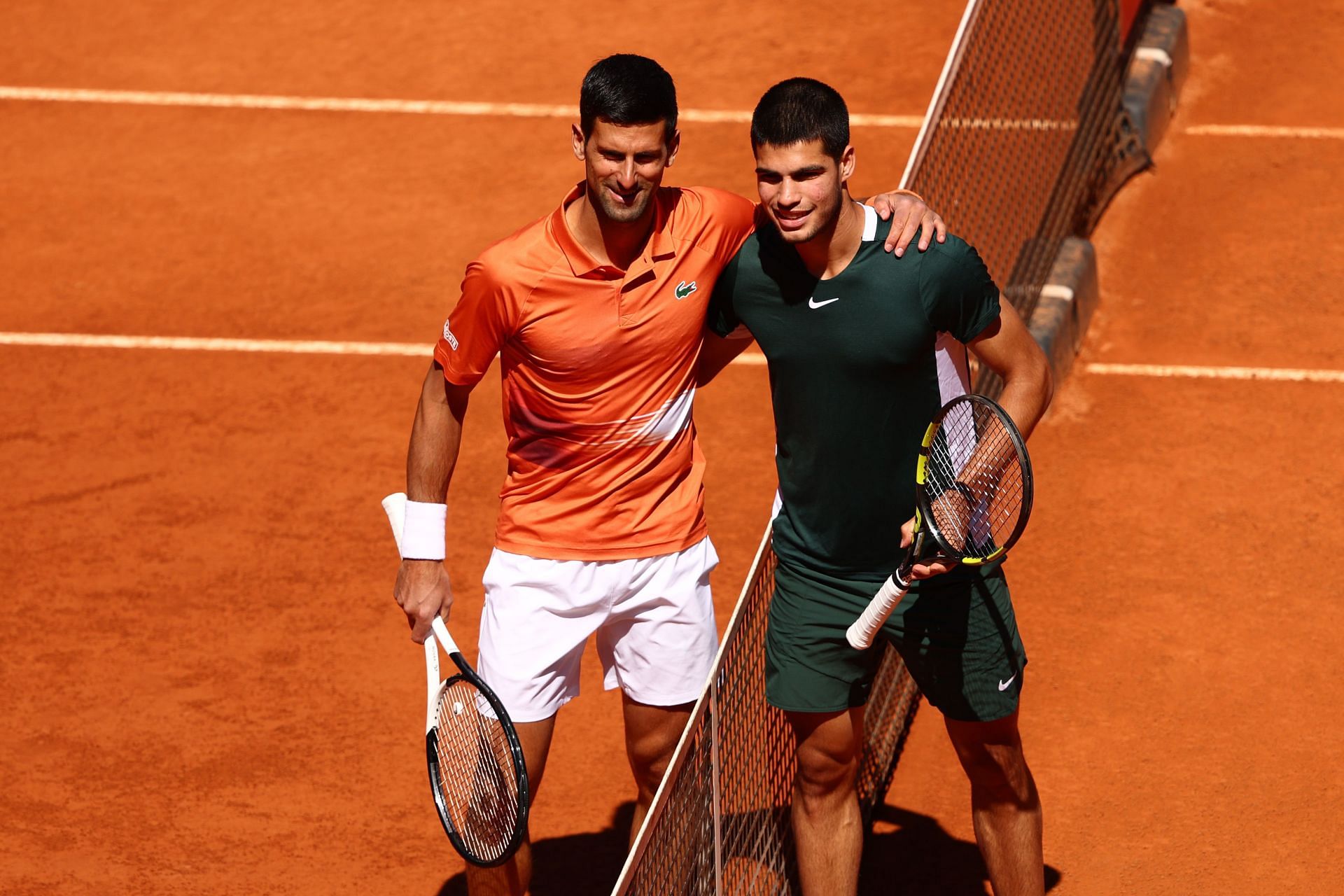 Novak Djokovic and Carlos Alcaraz pictured during 2022 Mutua Madrid Open