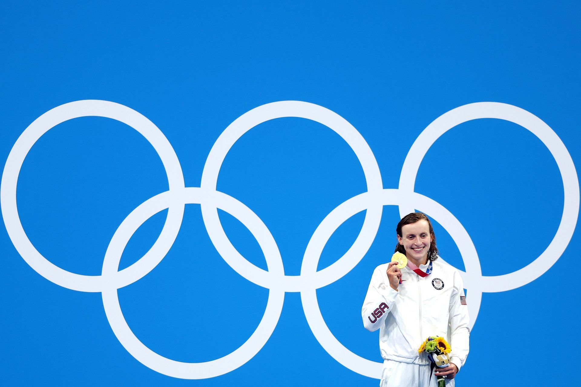 Ledecky poses with her gold medal at the Tokyo Olympics (Image via Getty)