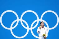 Ledecky poses with her gold medal at the Tokyo Olympics (Image via Getty)