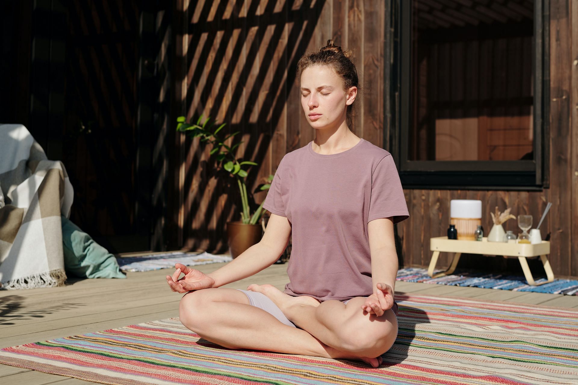 Relaxing yoga poses can help you calm down and rejuvenate (Image via Pexels @Werner Pfennig)
