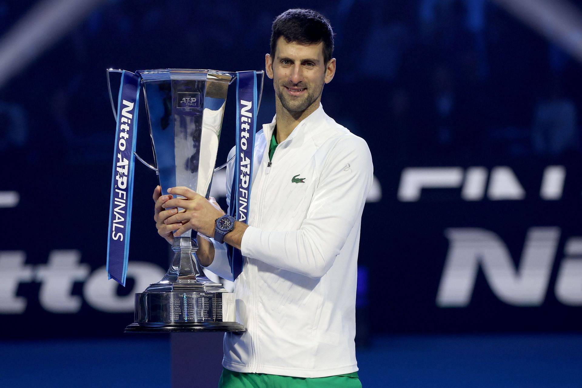 Novak Djokovic poses with the trophy at the 2022 ATP Finals
