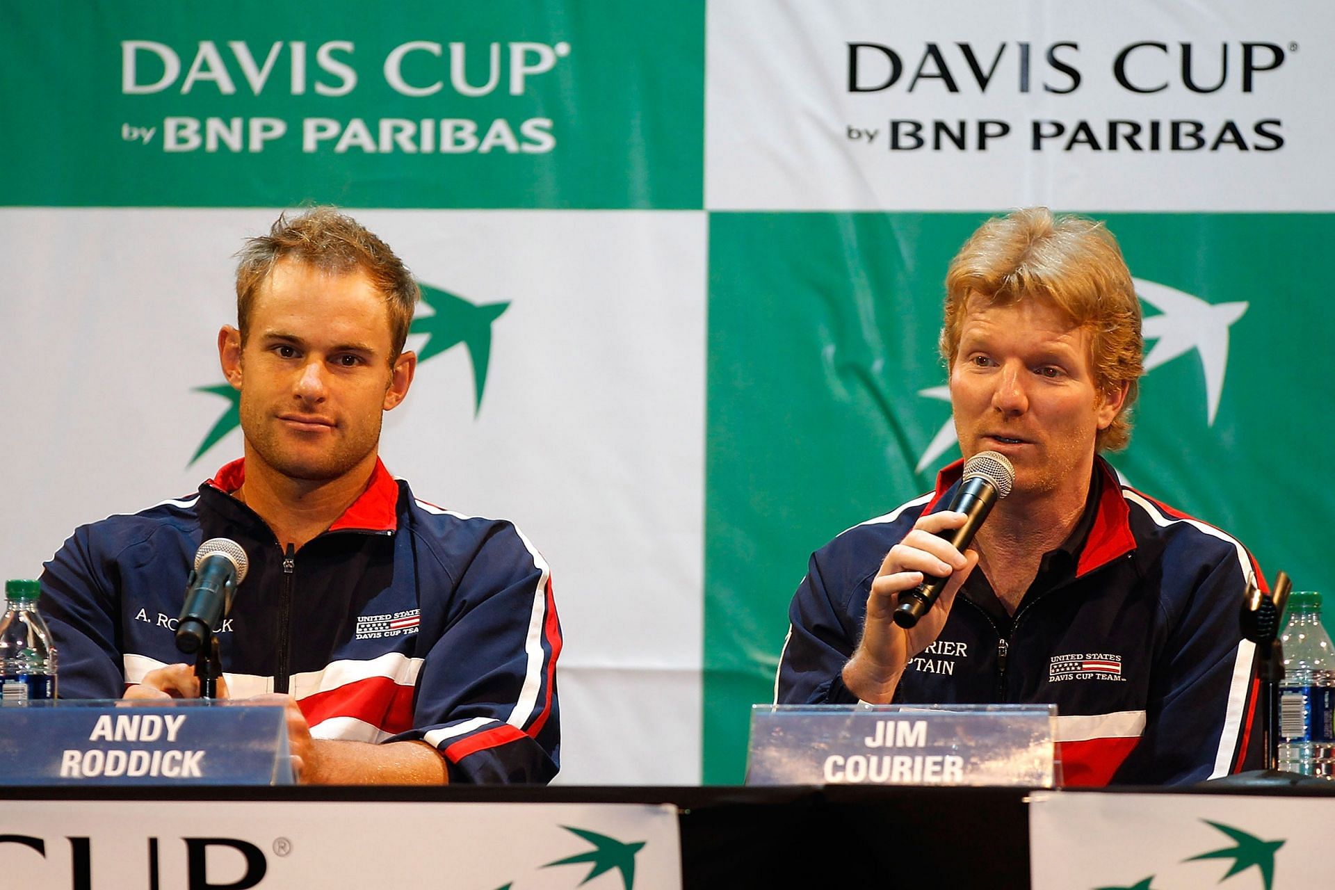 Andy Roddick (left) and captain Jim Courier (right) address the media after the Davis Cup draw ceremony on July 7, 2011.