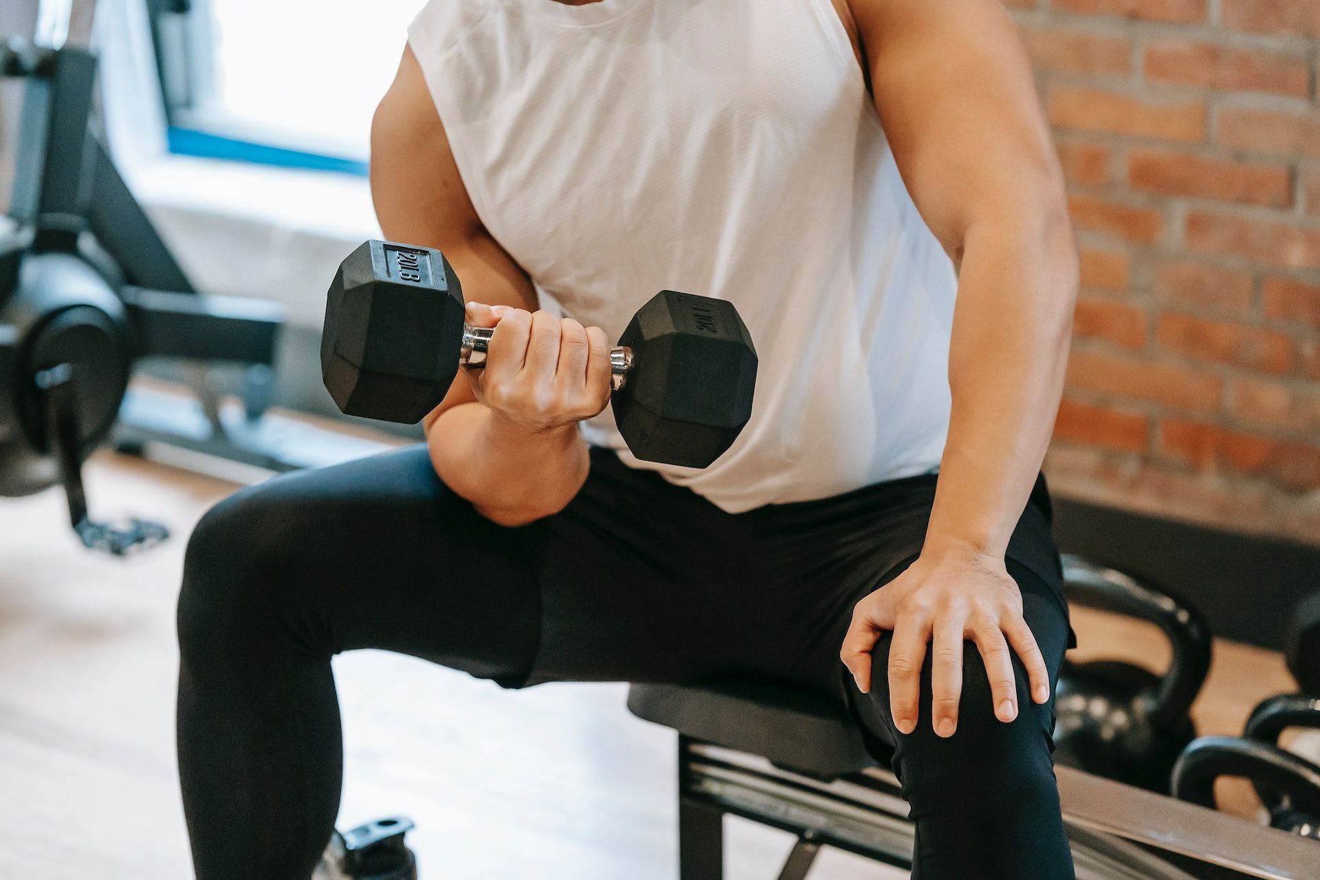 Weight lifting exercises can help burn arm fat and give your upper body a well-toned look. (Photo via Pexels/Andres  Ayrton)