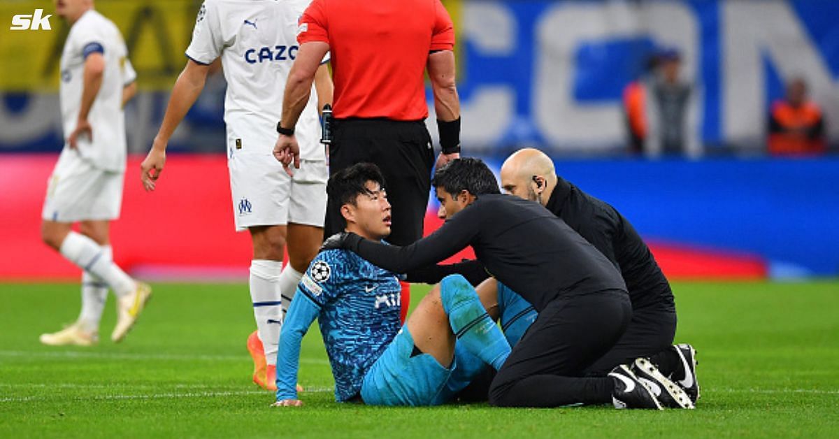 Tottenham Hotspur forward Son Heung-min reacts after taking a blow to the face during the match against Olympique Marseille.