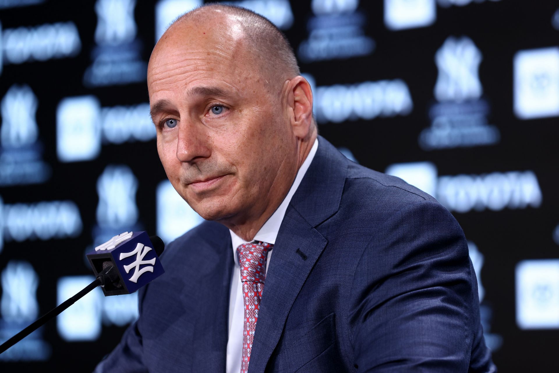 New York Yankees General Manager Brian Cashman speaks to the media prior to a game at Yankee Stadium