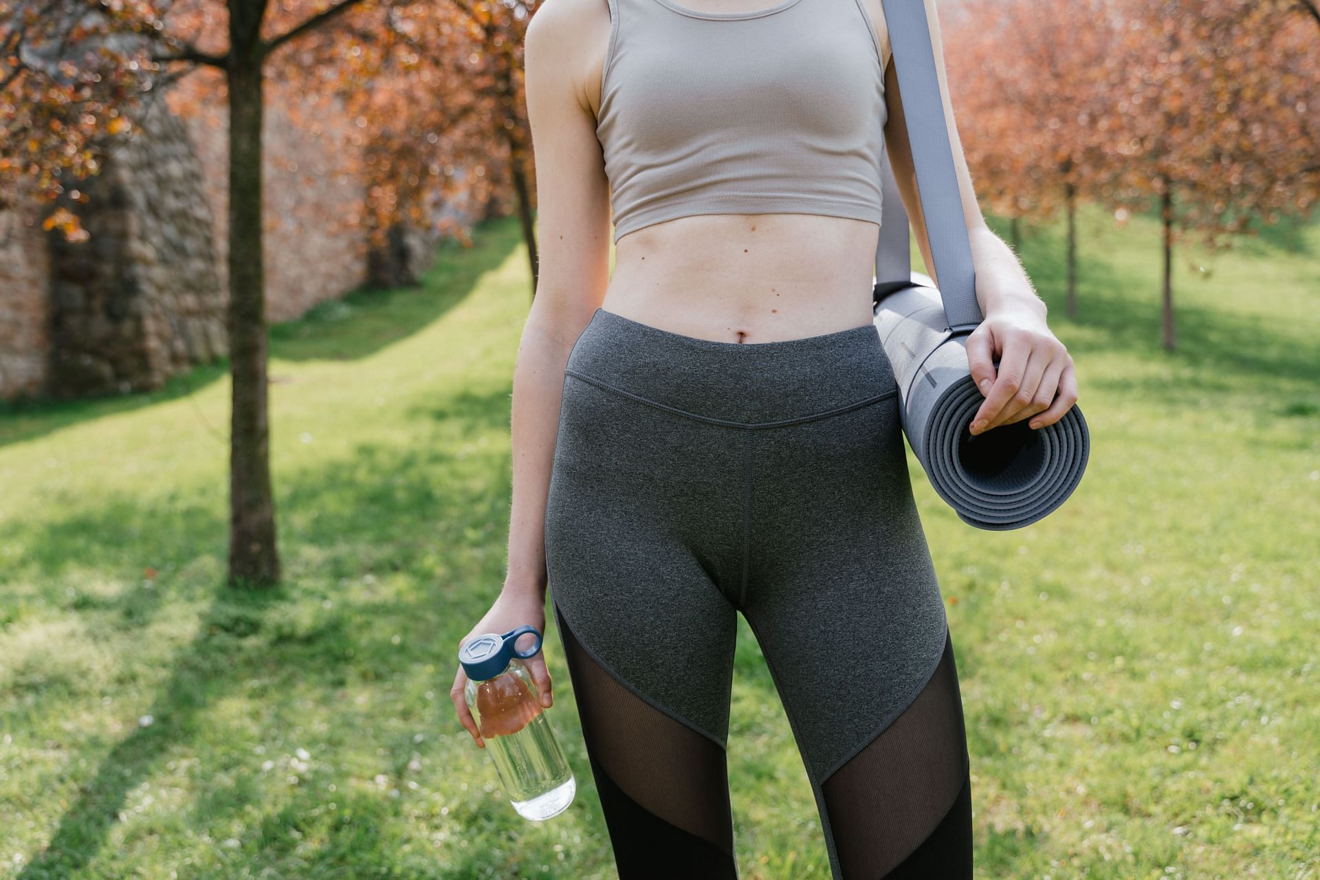 You can tone your stomach and develop a stronger core and lessen back pain with some simple flat stomach exercises  (Image via Pexels/ Mart Production)