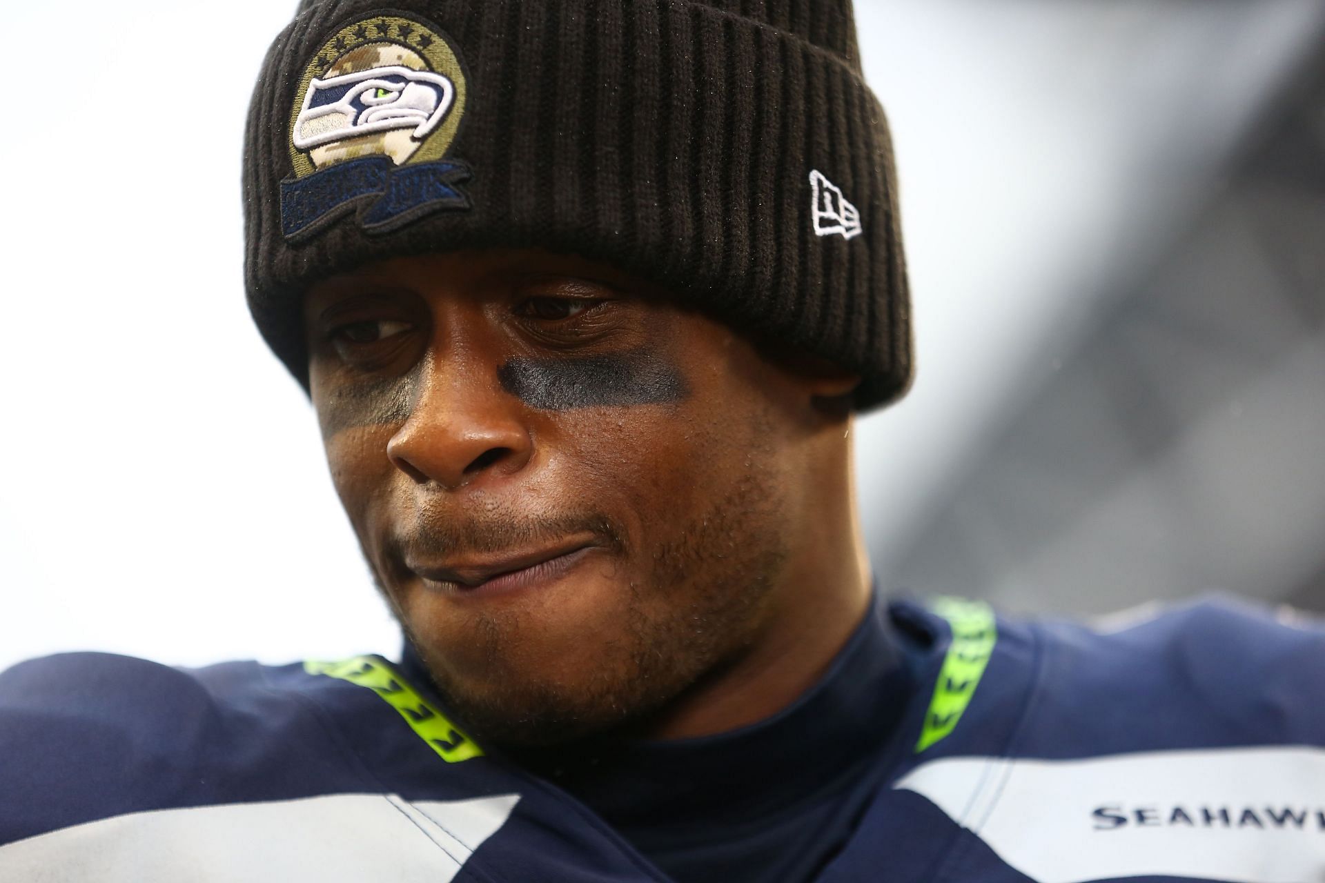 Geno Smith #7 of the Seattle Seahawks looks on after a game