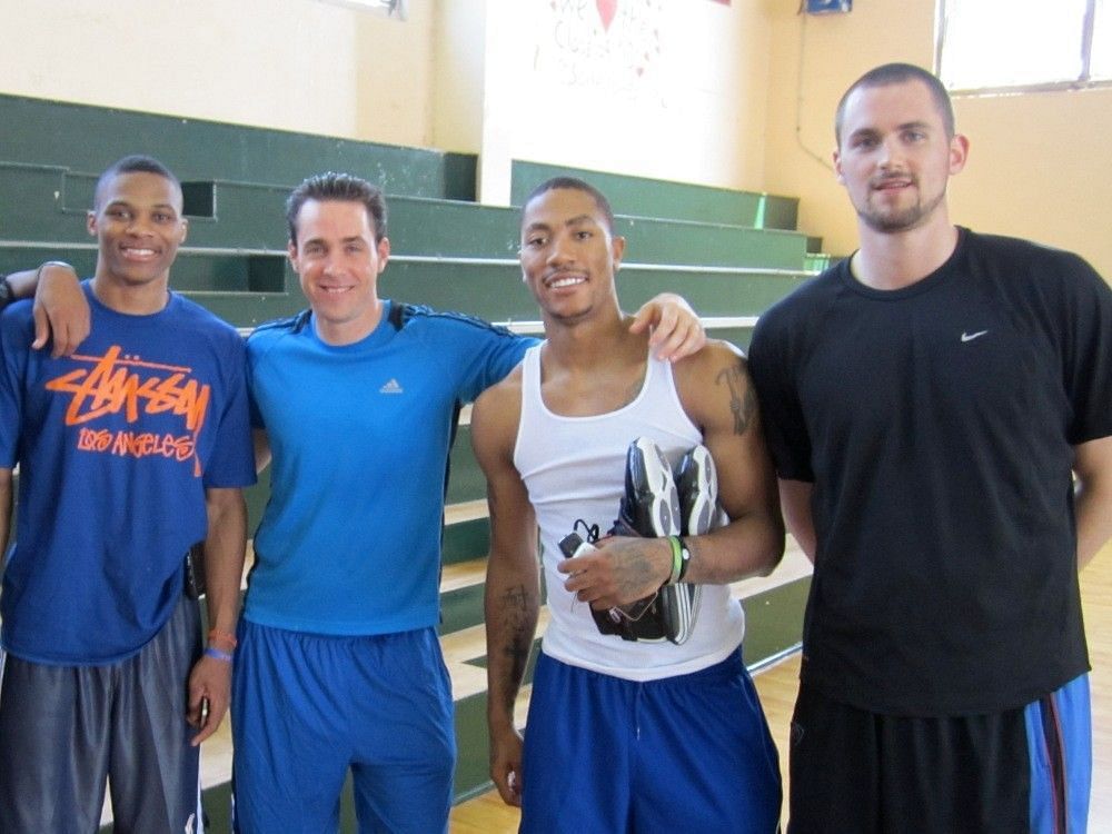 Basketball trainer Rob McClanaghan posing with NBA stars