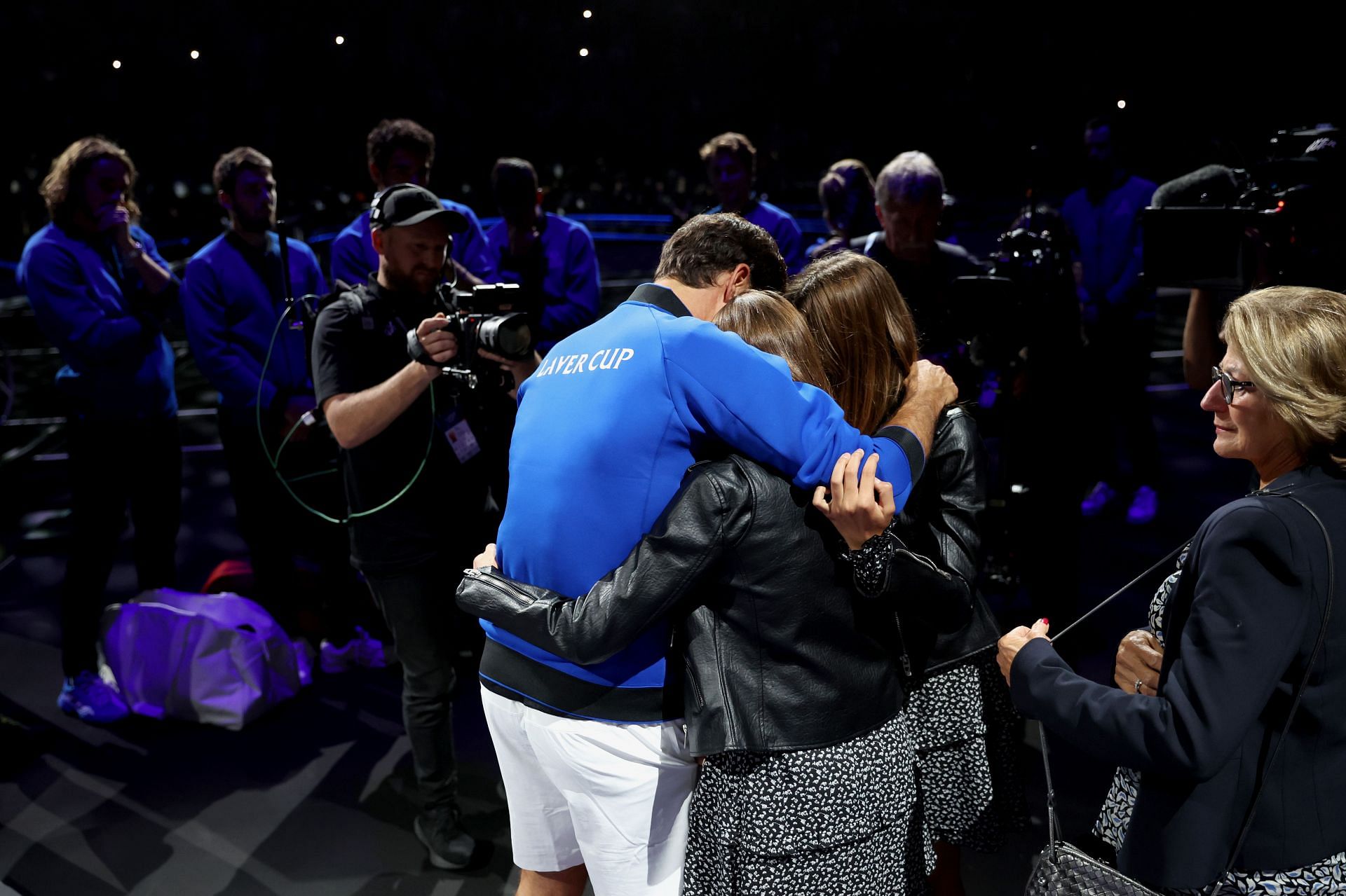 Roger Federer (center) hugs his kids in a highly emotional moment during the Laver Cup.