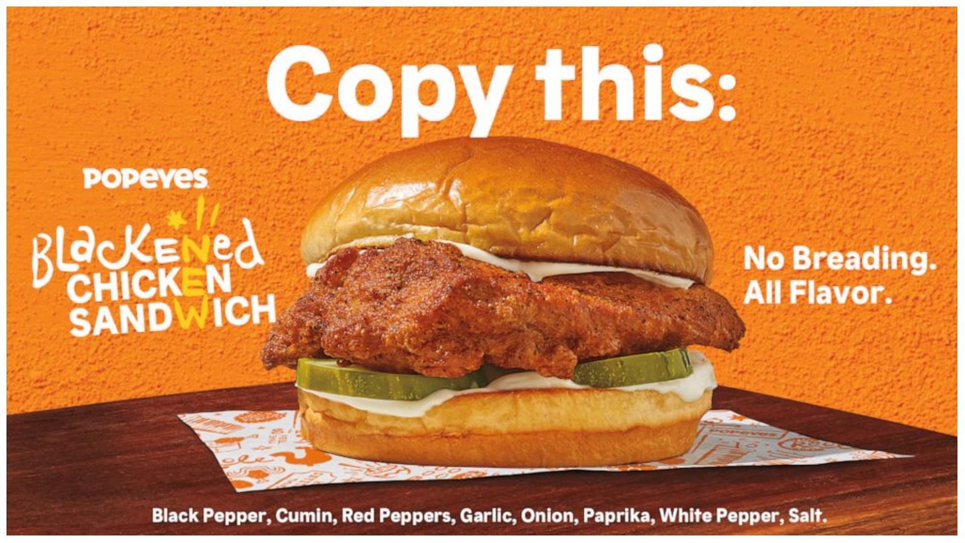 Blackened Fried Chicken Sandwich and the spice mix used to coat it (Image via Popeyes)