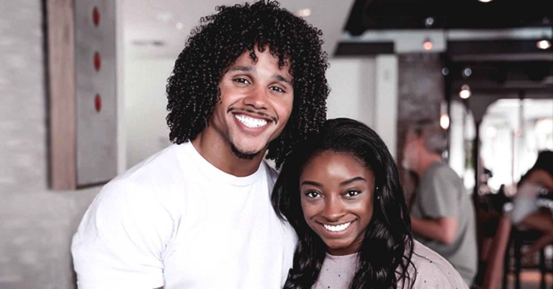 Simone Biles and Stacey Ervin Jr. (AmoMama)