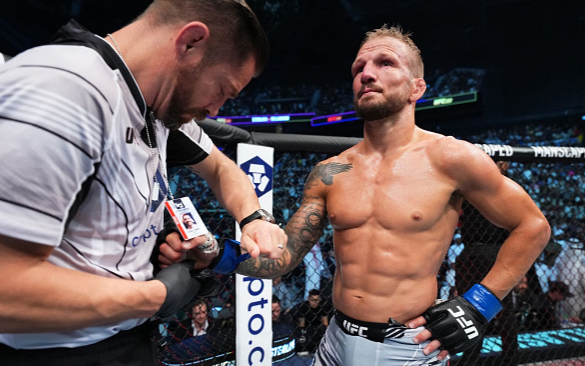 T.J. Dillashaw getting gloves taken off after UFC 280 loss (Image via Getty)
