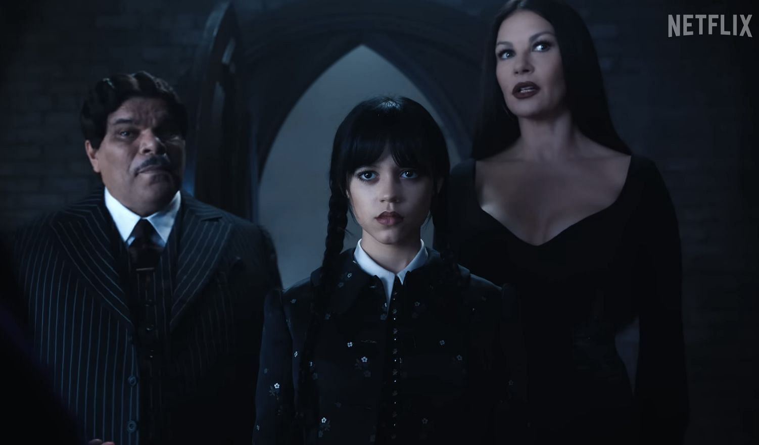 Jenna Ortega as Wednesday, Catherine Zeta-Jones as Morticia Addams and Luis Guzm&aacute;n as Gomez Addams in Wednesday. (Photo via Netflix)