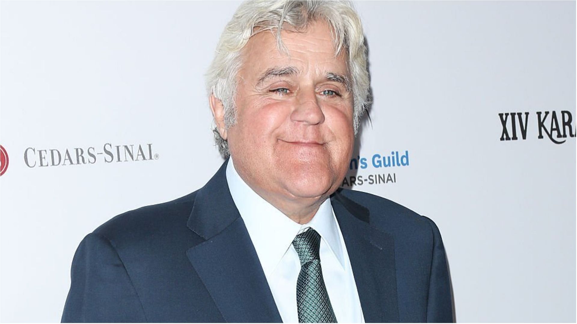 Jay Leno suffered serious burns after a car at his Los Angeles garage started burning (Image via Paul Archuleta/Getty Images)