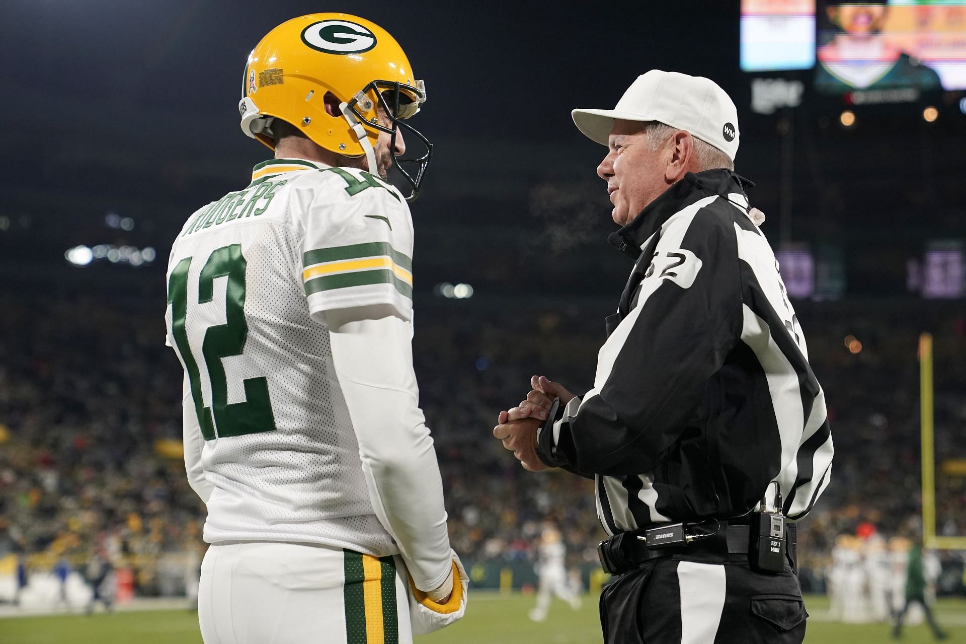 NFL referee talking to Aaron Rodgers - Tennessee Titans v Green Bay Packers