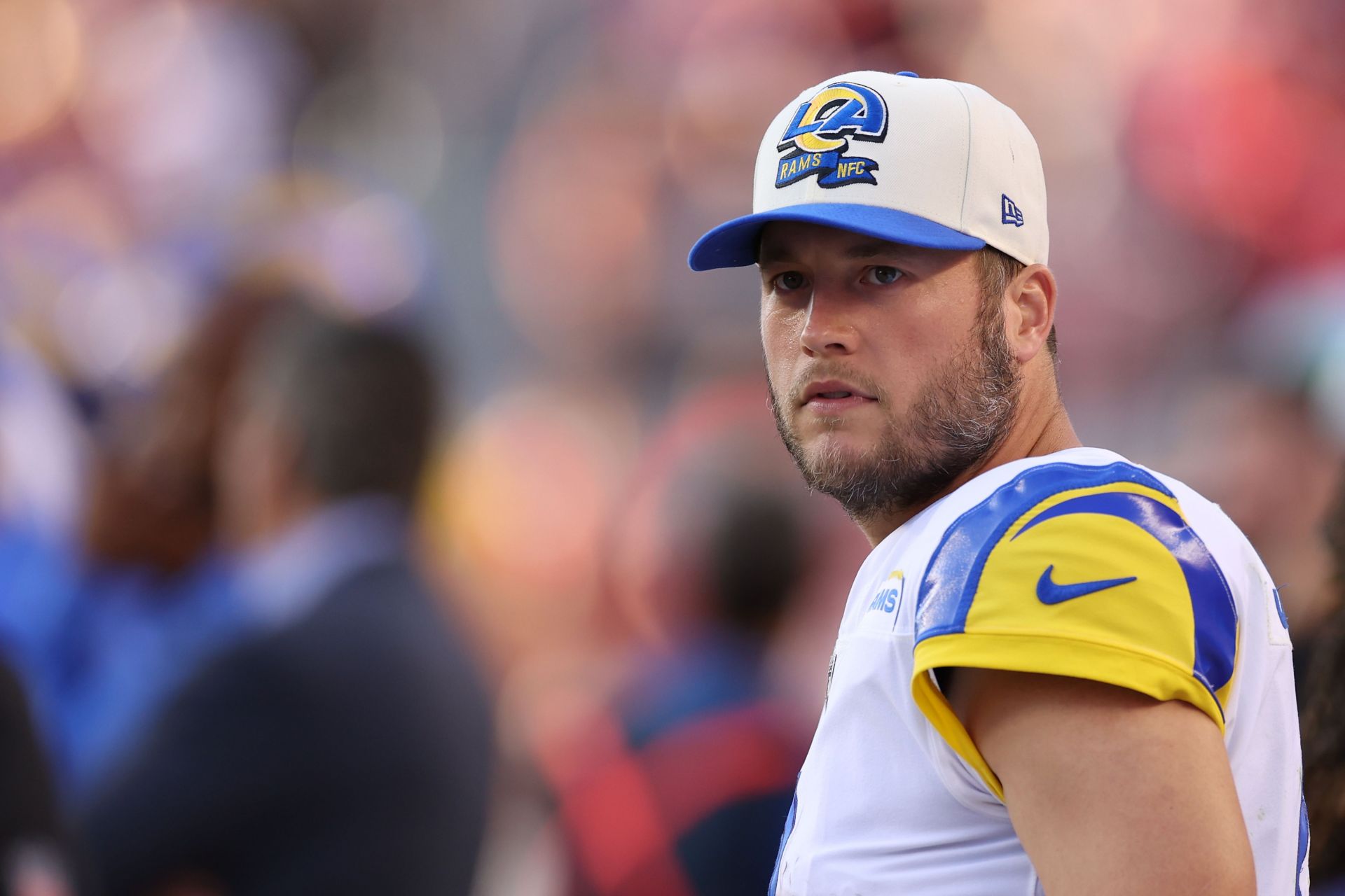 Los Angeles Rams quarterback Matthew Stafford (9) looks to pass while being  chased by San Franc …