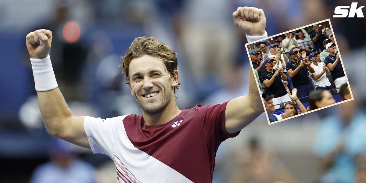 Casper Ruud smiles towards his player box at the 2022 US Open.