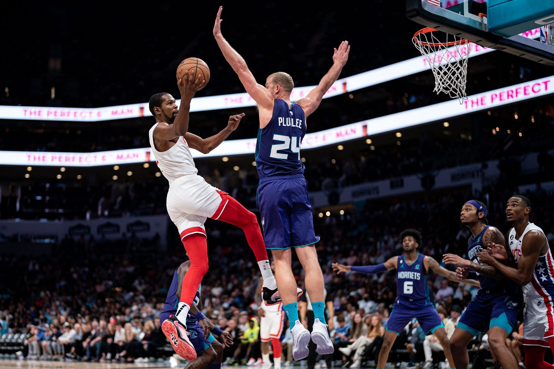 Kevin Durant of the Brooklyn Nets drives to the basket while guarded by Mason Plumlee of the Charlotte Hornets