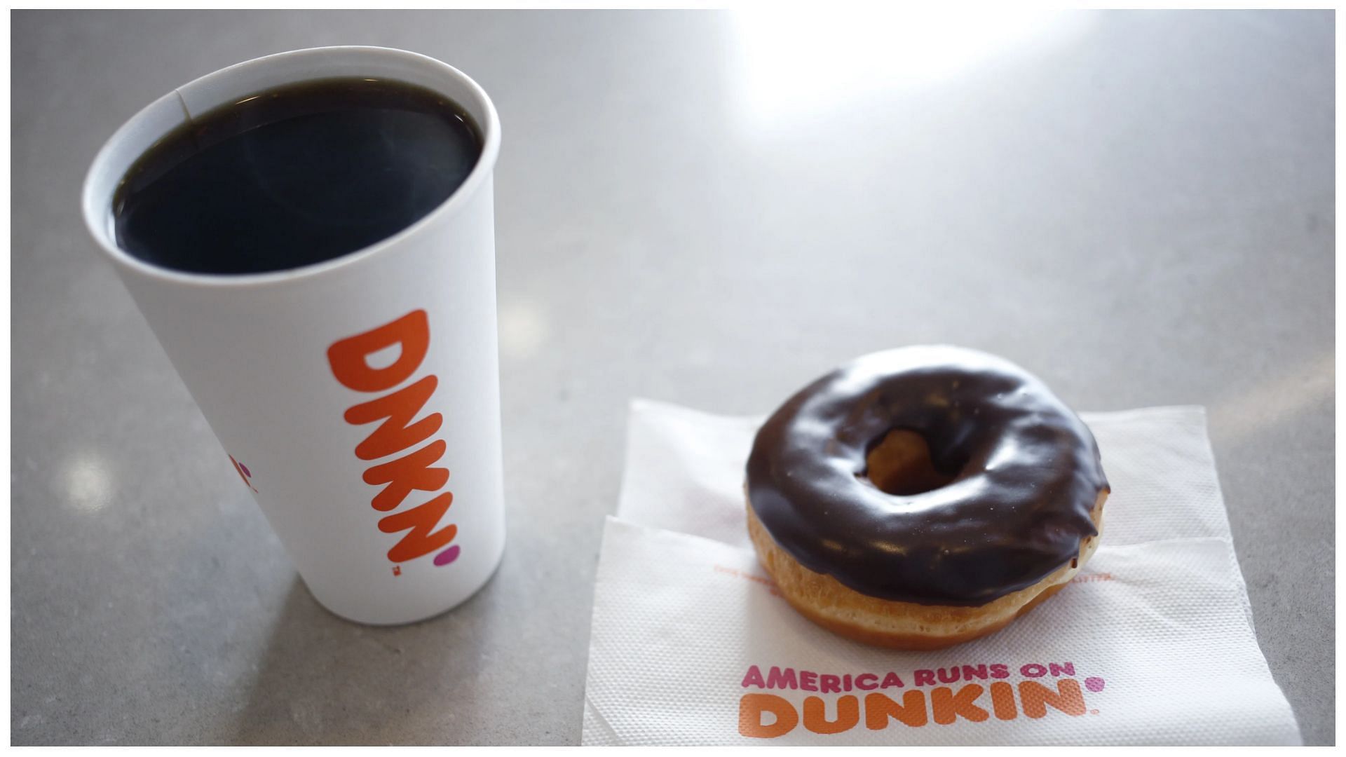 black coffee and chocolate frosted donut at a store in Mount Washington, Kentucky (Images via Luke Sharrett/Bloomberg/Getty Images)