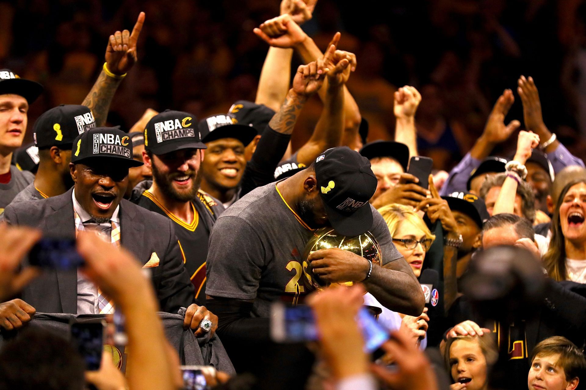 LeBron James of the Cleveland Cavaliers holds the Larry O&#039;Brien Championship Trophy in 2016