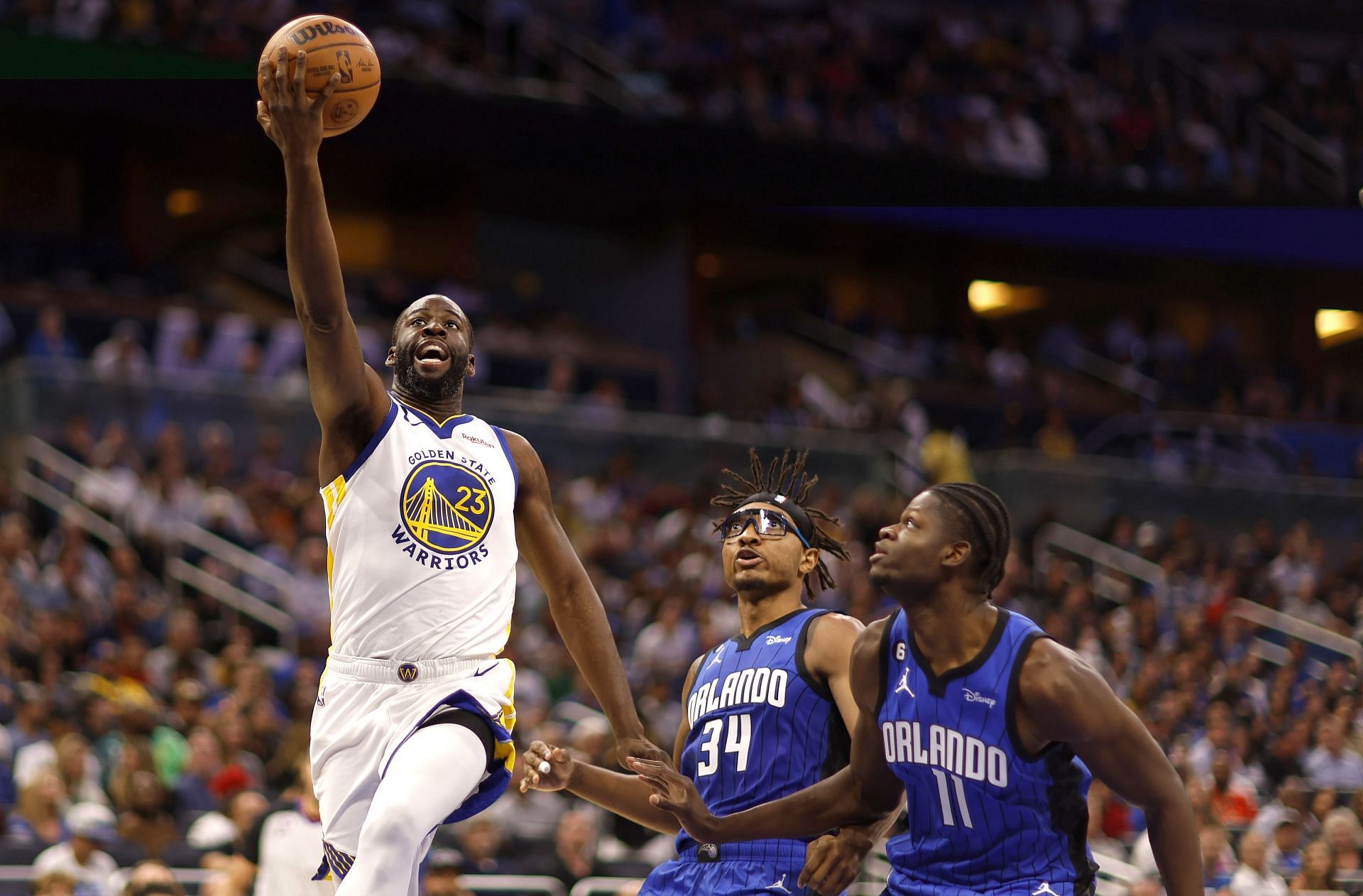 Draymond Green attempts to score off a layup