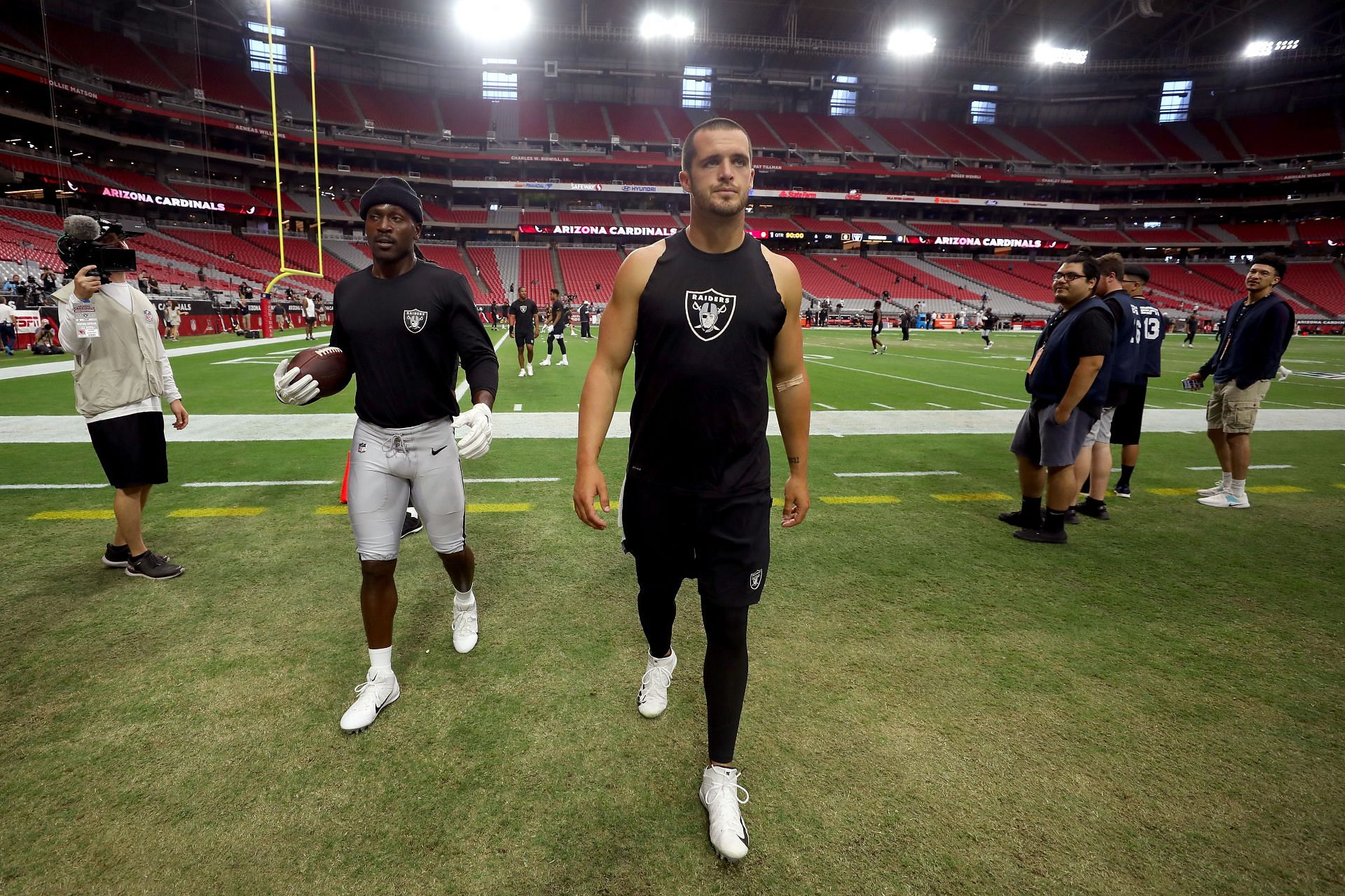 Rapper Ice Cube, right, hugs Las Vegas Raiders quarterback Derek Carr  during the first round of the NFL football draft Thursday, April 28, 2022,  in Las Vegas. (AP Photo/John Locher Stock Photo 