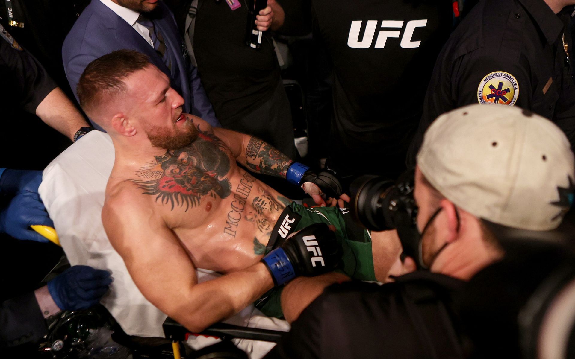 Conor McGregor being taken away on a stretcher after his leg break at UFC 264