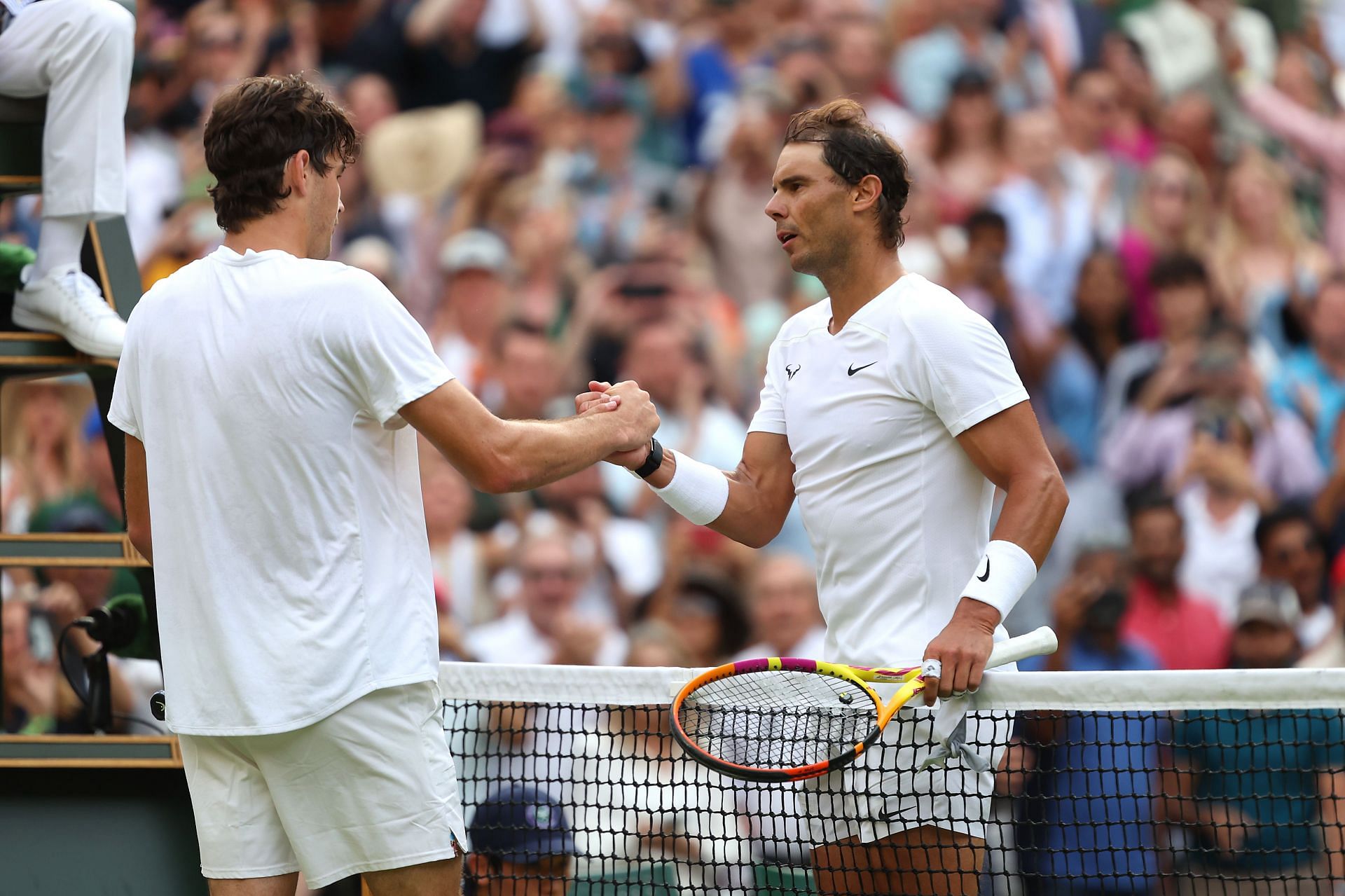 Rafael Nadal (right) shakes hands with Taylor Fritz (left) at the 2022 Wimbledon Championships.