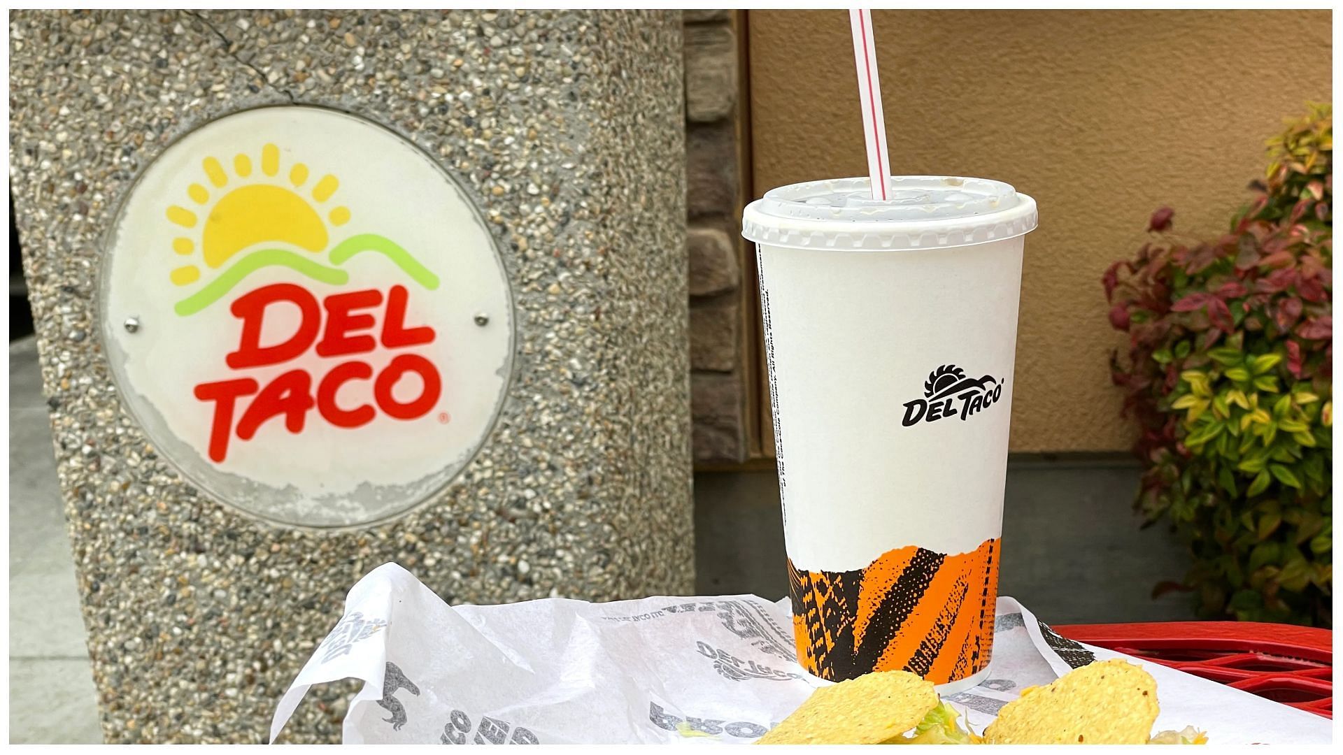 tacos and a beverage on a table outside a Del Taco restaurant in Fairfield, California (Photo Illustration by Justin Sullivan/Getty Images)