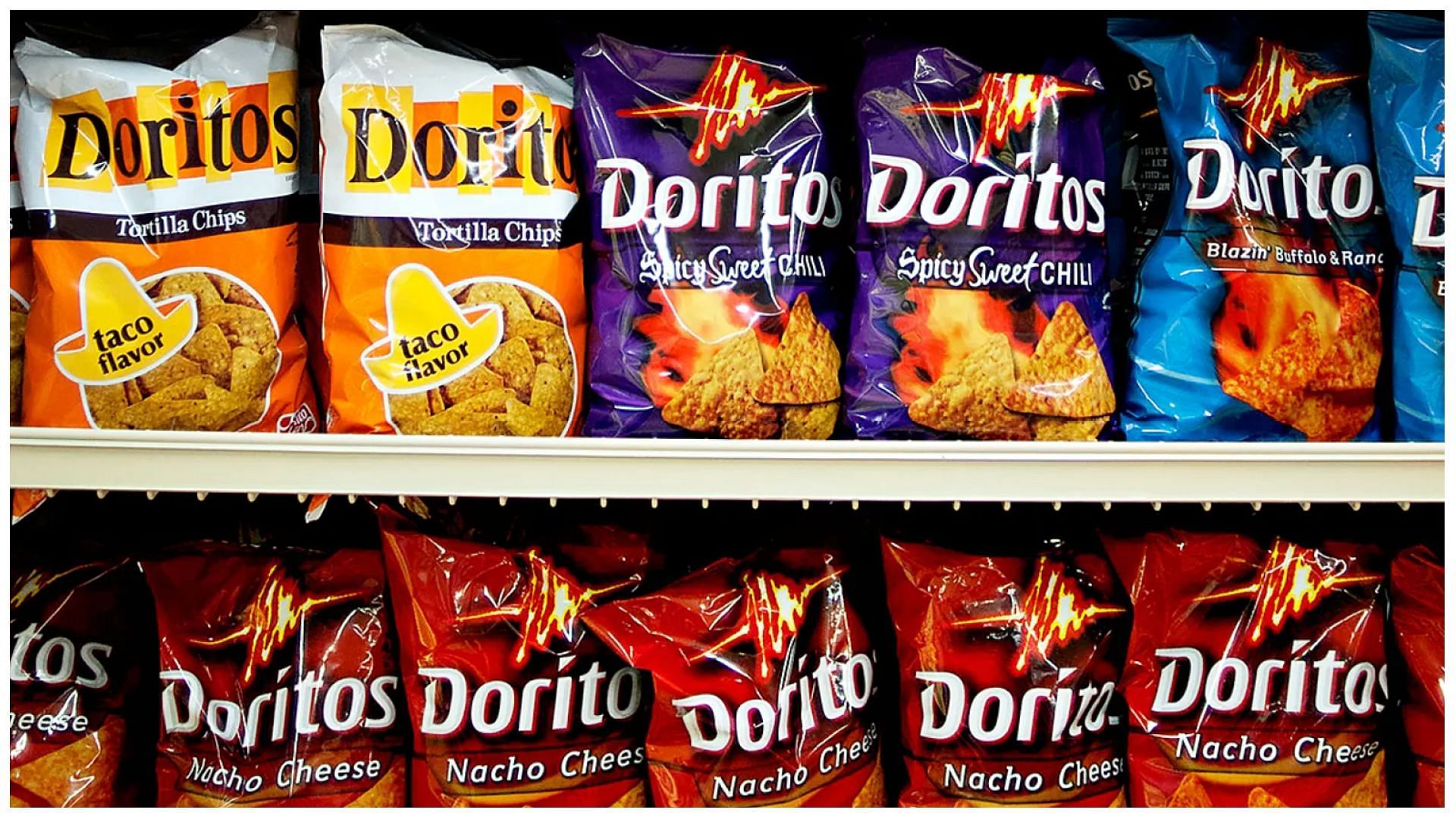 various flavors of Doritos brand snack chips on an aisle in a supermarket in Princeton, Illinois (Image via Daniel Acker/Bloomberg via Getty Images)