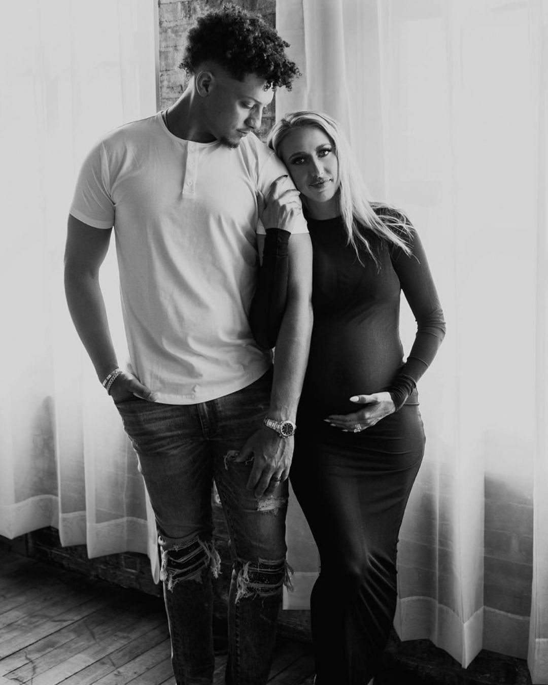 Mahomes posing with Brittany in a black and white photo. Source: Brittany Mahomes IG