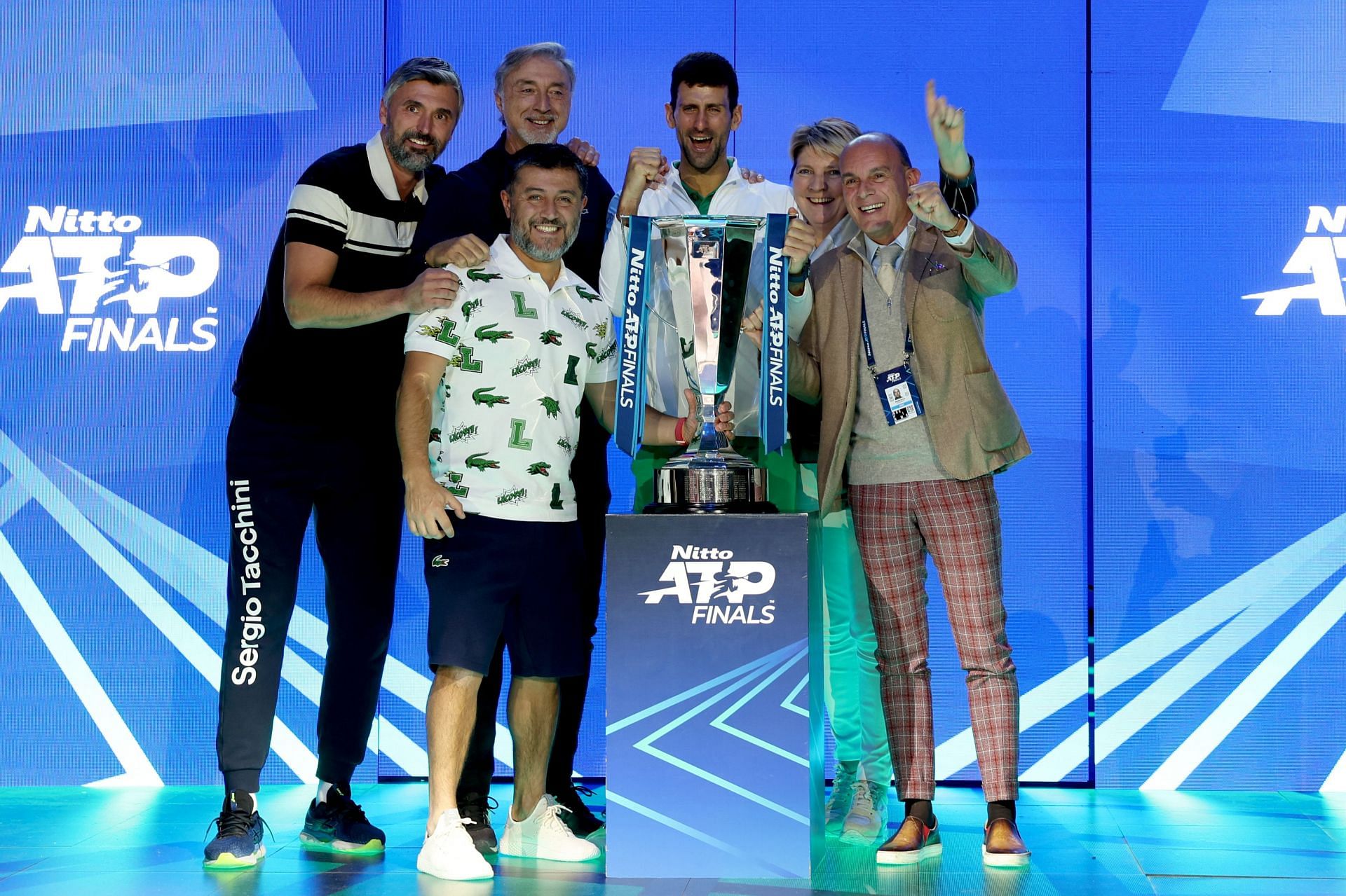 Novak Djokovic (top row, third from left) celebrates his ATP Finals title with his team.