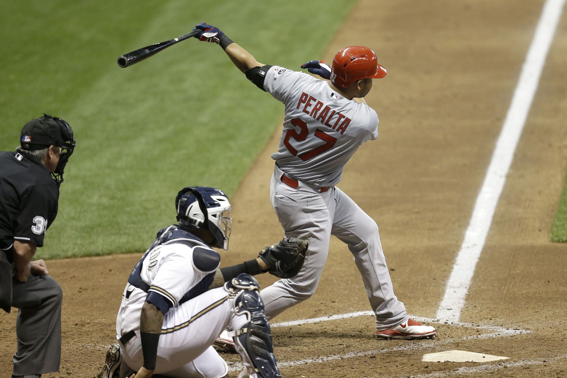 Jhonny Peralta #27 of the St. Louis Cardinals hits an RBI single in the sixth inning against the Milwaukee Brewers at Miller Park on September 15, 2015 in Milwaukee, Wisconsin.