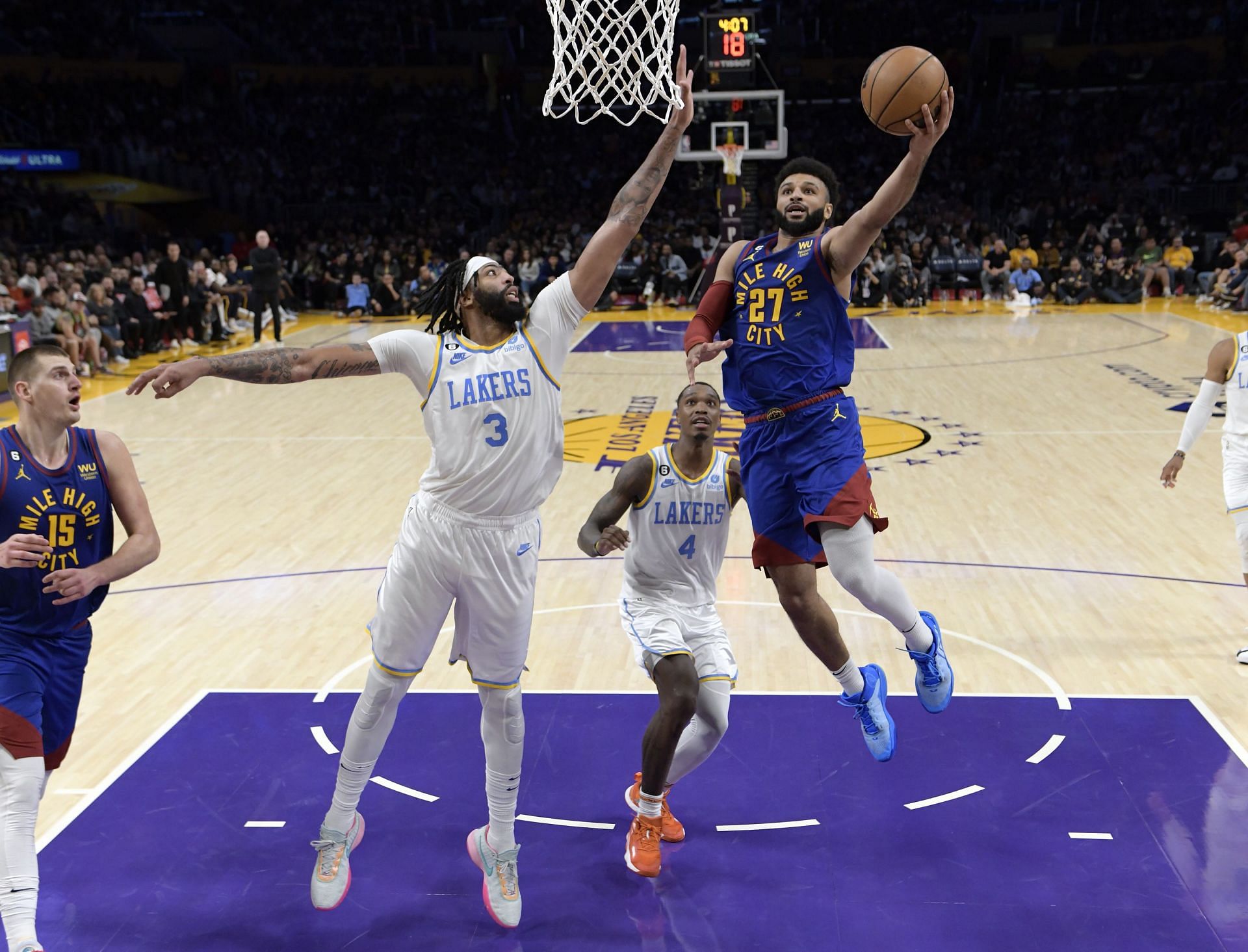 Anthony Davis goes up to block a shot