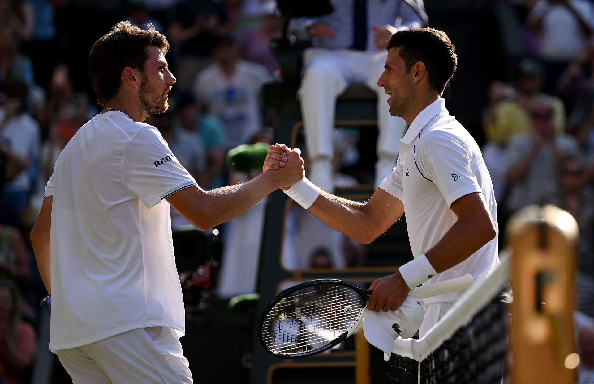 Cameron Norrie (L) and Novak Djokovic at the 2022 Wimbledon Championships.
