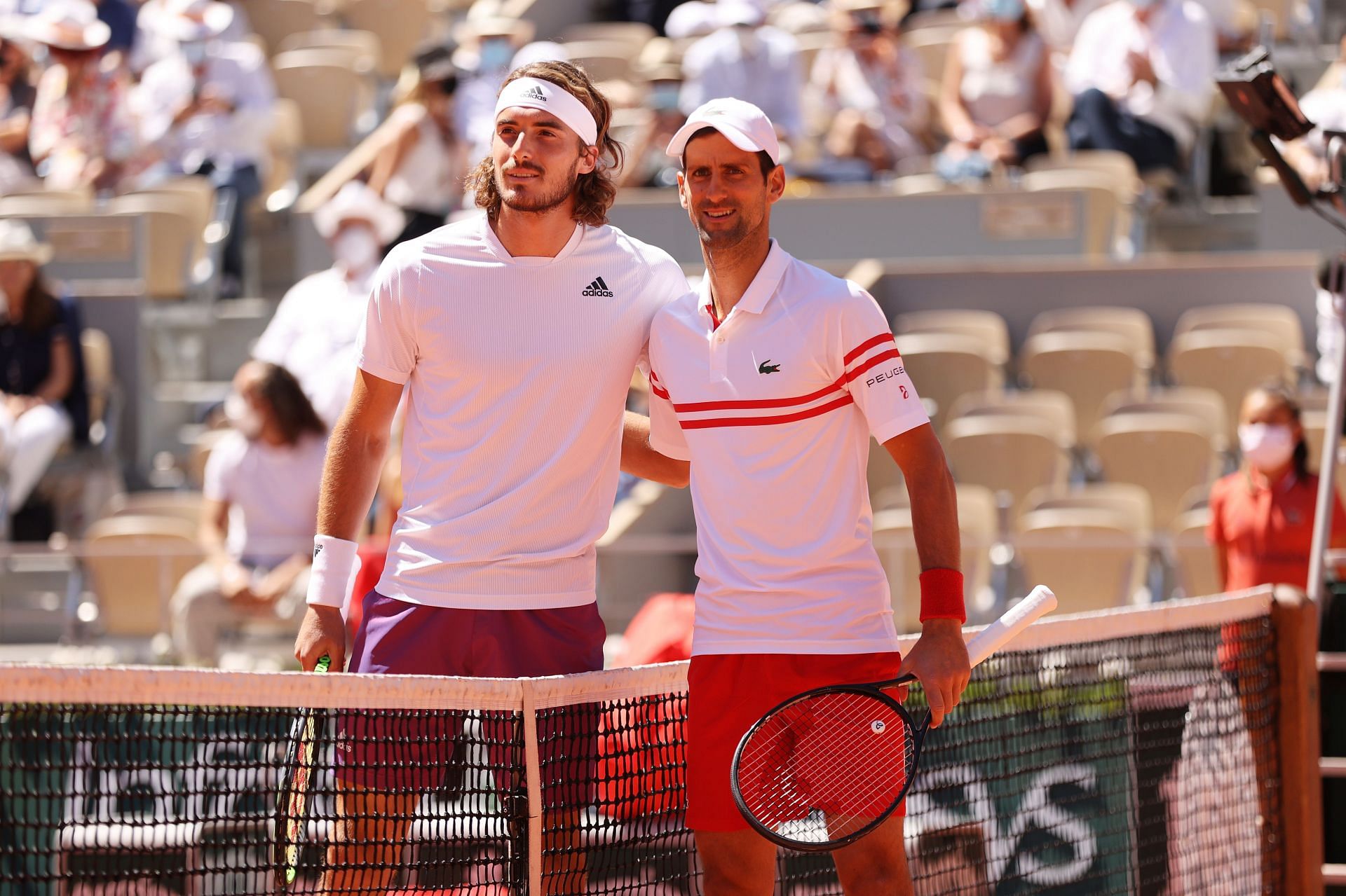 Stefanos Tsitsipas (L) and Novak Djokovic