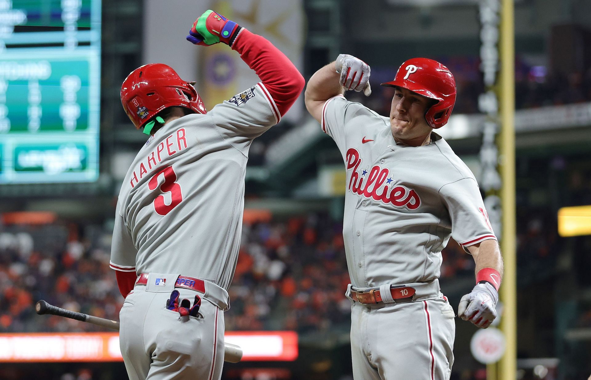 Bryce Harper and J.T. Realmuto of the Philadelphia Phillies celebrate after a home run in the 2022 World Series