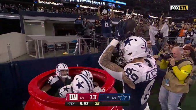 NFL Dallas Cowboys running back Ezekiel Elliott jumps into the Salvation  Army kettle 