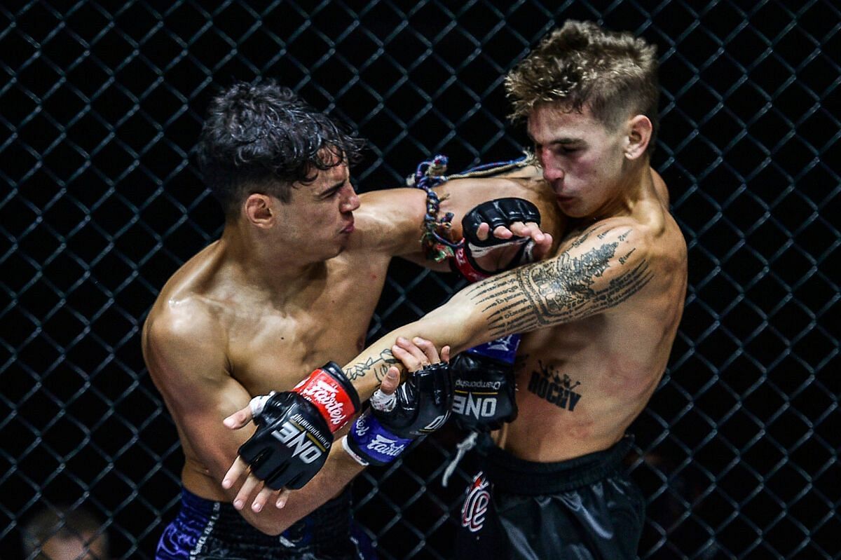 Joseph Lasiri cracks Rocky Ogden with an elbow. [Photo ONE Championship]