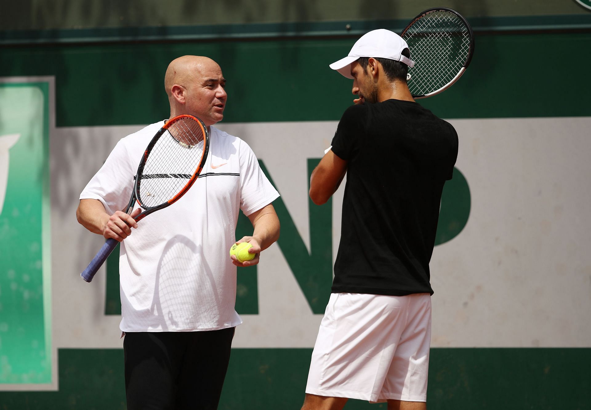 Andre Agassi with Novak Djokovic during the 2017 French Open