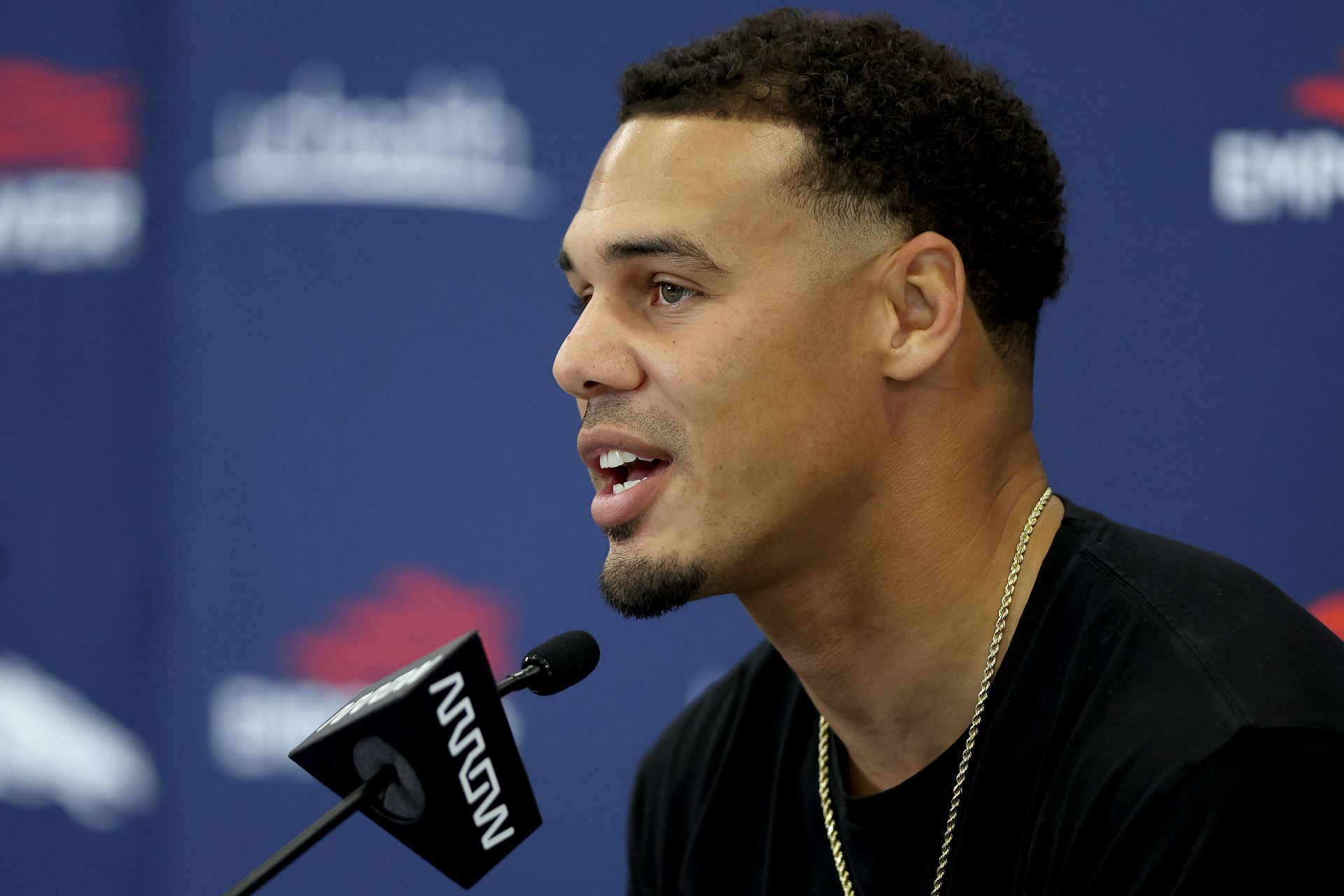 Safety Justin Simmons of the Denver Broncos fields questions from the media